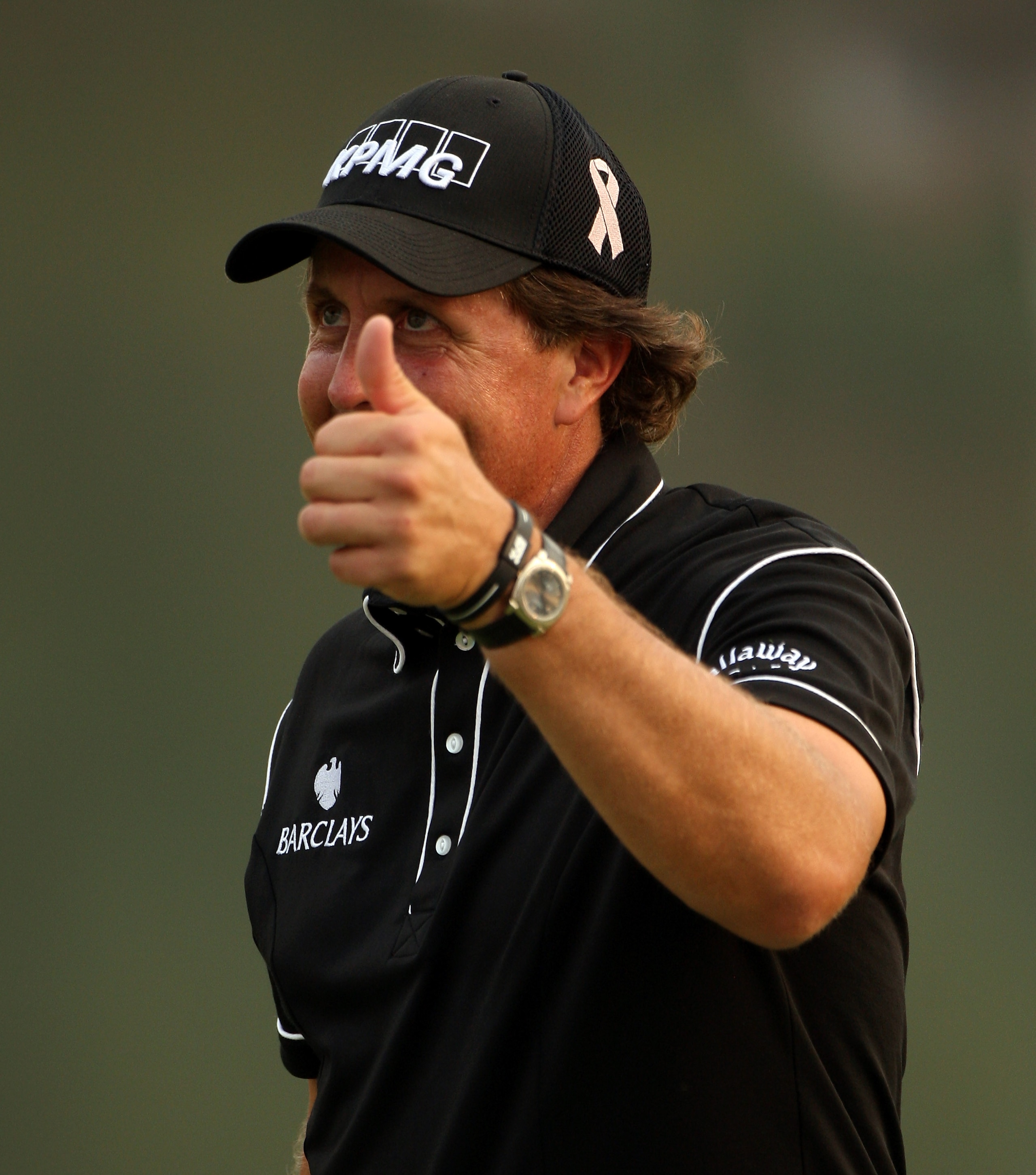 SHANGHAI, CHINA - NOVEMBER 06:  Phil Mickelson of the USA smiles on the 18th hole during the second round of the WGC-HSBC Champions at Sheshan International Golf Club on November 6, 2009 in Shanghai, China.  (Photo by Andrew Redington/Getty Images)