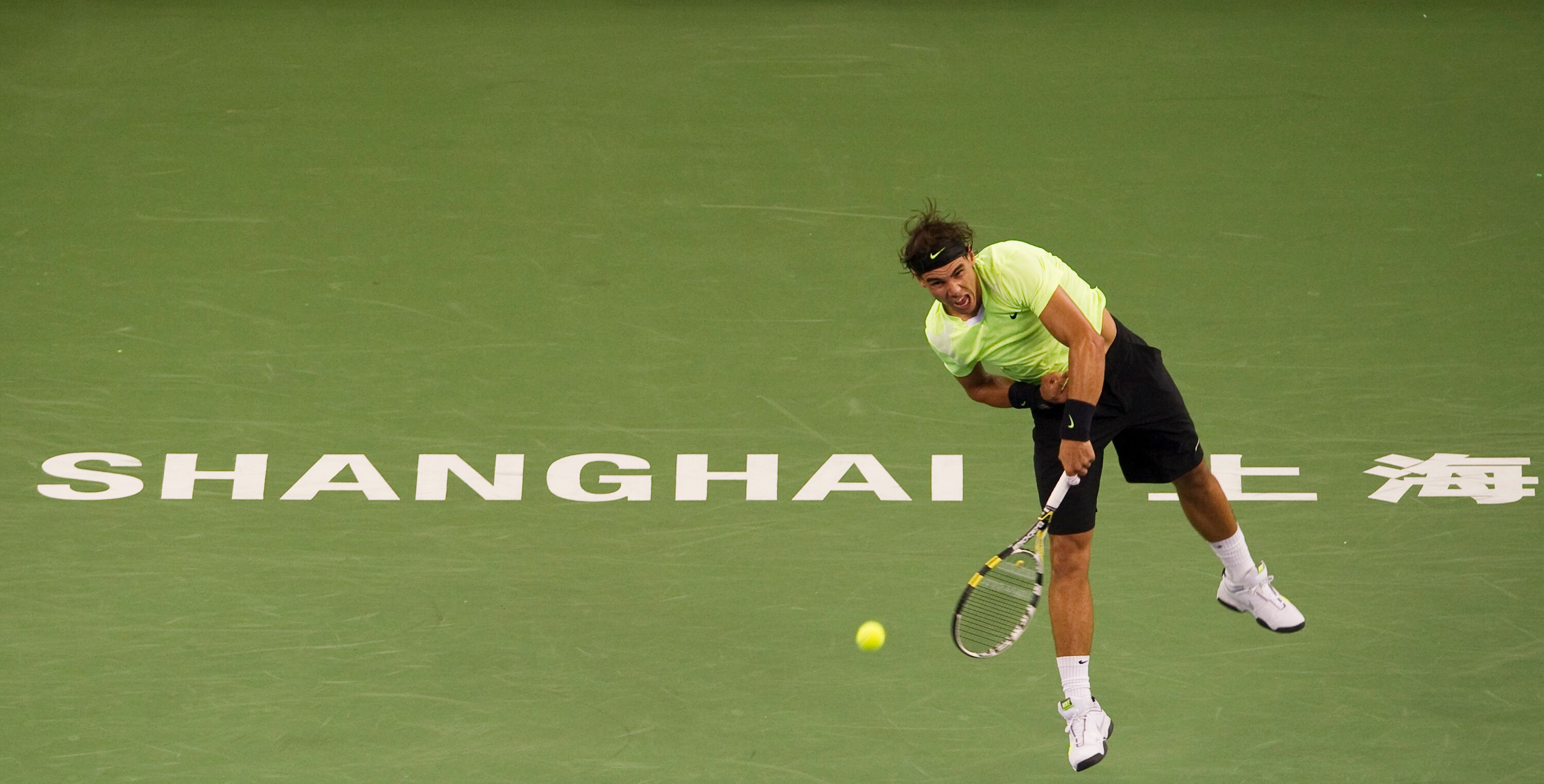 SHANGHAI, CHINA - OCTOBER 14:  Rafael Nadal of Spain serves to Jurgen Melzer of Austria during day four of the 2010 Shanghai Rolex Masters at the Shanghai Qi Zhong Tennis Center on October 14, 2010 in Shanghai, China.  (Photo by Victor Fraile/Getty Images