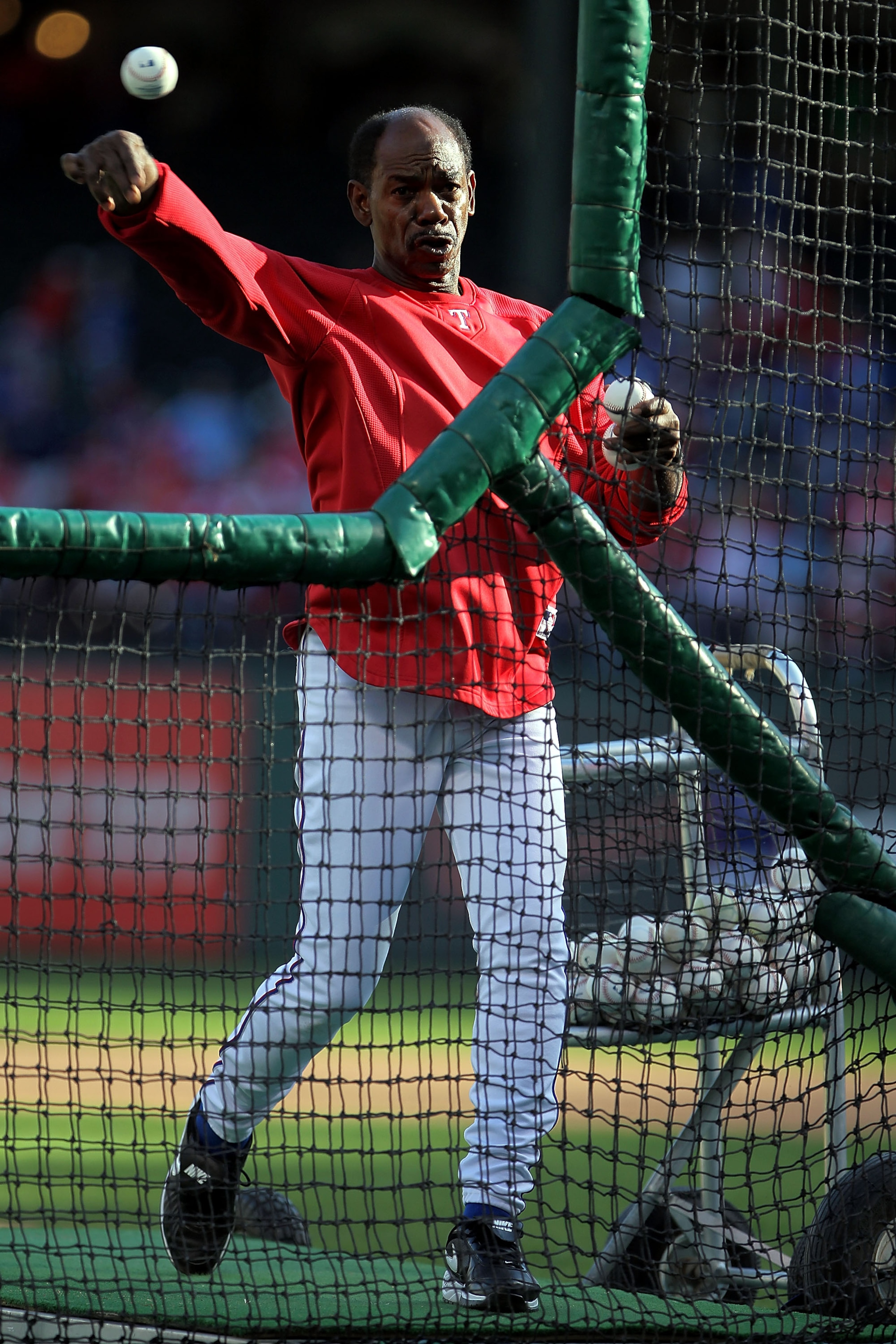 ARLINGTON, TX - NOVEMBER 01:  Manager Ron Washington of the Texas Rangers pitches batting practice to his players prior to playing against the San Francisco Giants in Game Five of the 2010 MLB World Series at Rangers Ballpark in Arlington on November 1, 2