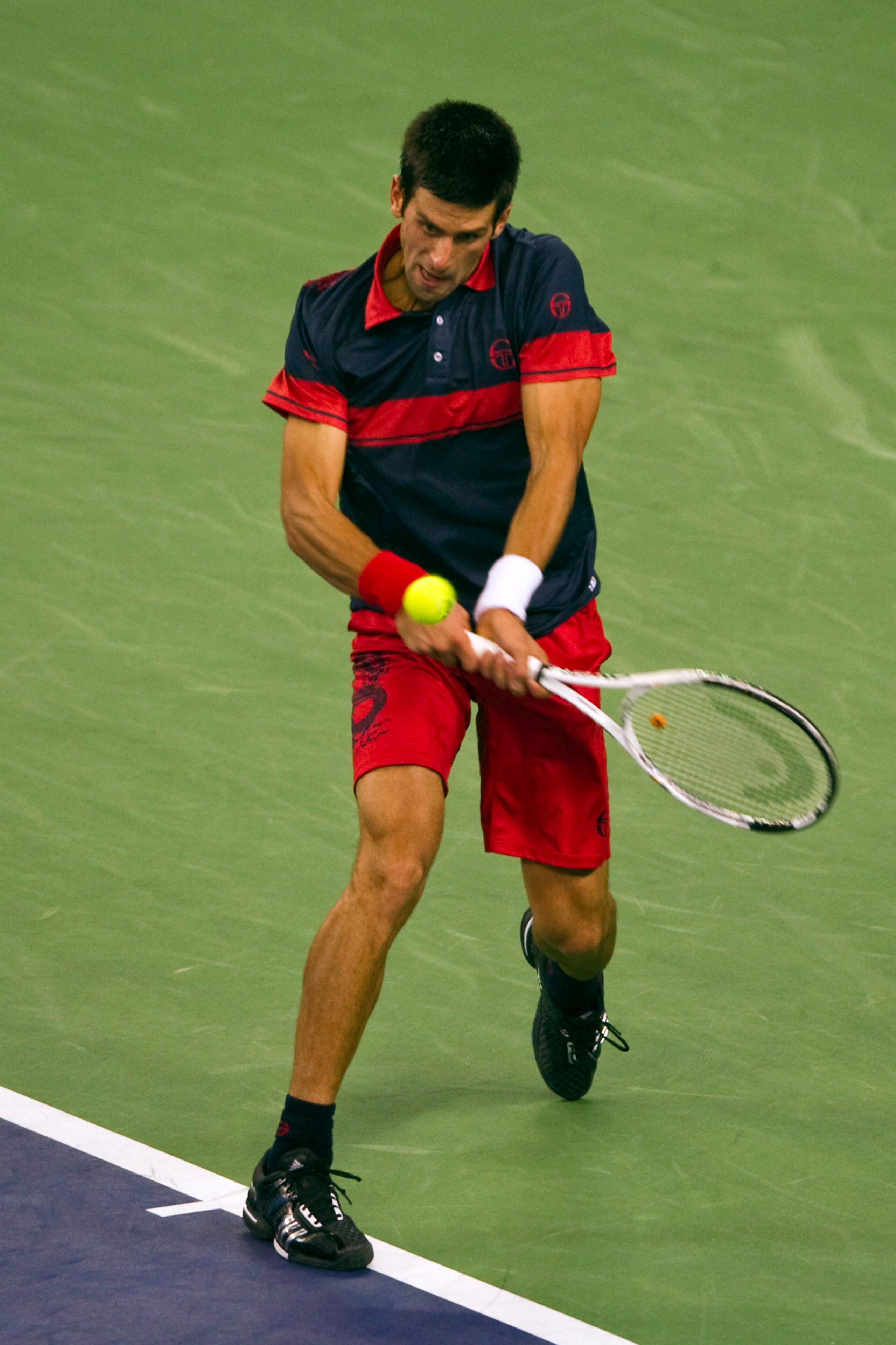 SHANGHAI, CHINA - OCTOBER 16: Novak Djokovic of Serbia returns a ball to Roger Federer of Switzerland during day six of the 2010 Shanghai Rolex Masters at the Shanghai Qi Zhong Tennis Center on October 16, 2010 in Shanghai, China. (Photo by Victor Frail SHANGHAI, CHINA - OCTOBER 16: Novak Djokovic of Serbia returns a ball to Roger Federer of Switzerland during day six of the 2010 Shanghai Rolex Masters at the Shanghai Qi Zhong Tennis Center on October 16, 2010 in Shanghai, China. (Photo by Victor Frail