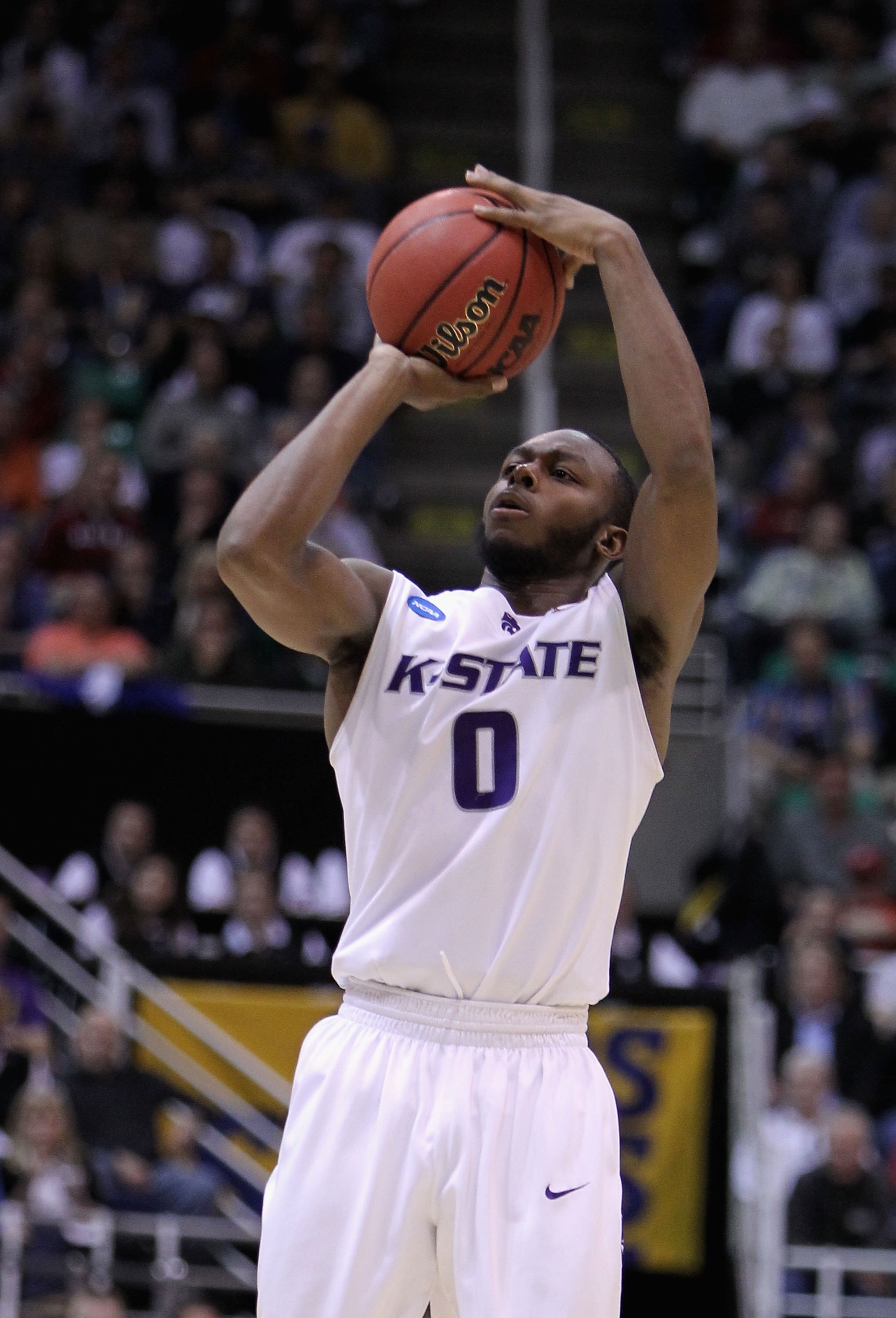 SALT LAKE CITY - MARCH 25:  Jacob Pullen #0 of the Kansas State Wildcats puts up a shot against the Xavier Musketeers during the west regional semifinal of the 2010 NCAA men's basketball tournament at the Energy Solutions Arena on March 25, 2010 in Salt L