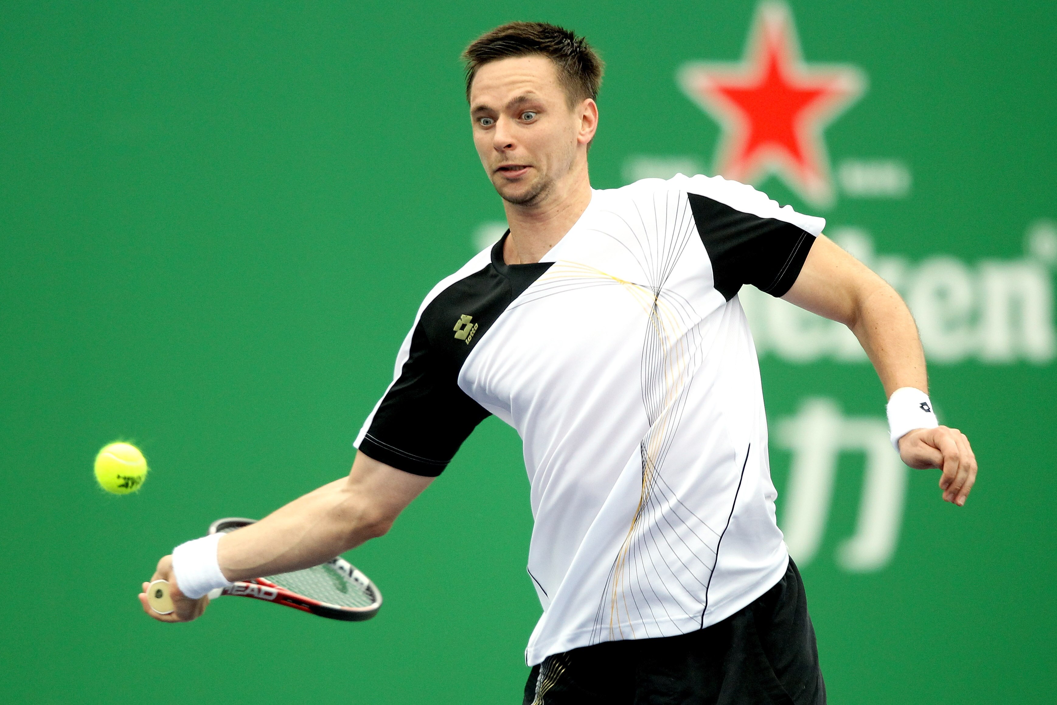 SHANGHAI, CHINA - OCTOBER 13:  Robin Soderling of Sweden returns a shot to Janko Tipsarevic of Serbia during day three of the 2010 Shanghai Rolex Masters at the Shanghai Qi Zhong Tennis Center on October 13, 2010 in Shanghai, China.  (Photo by Matthew Sto