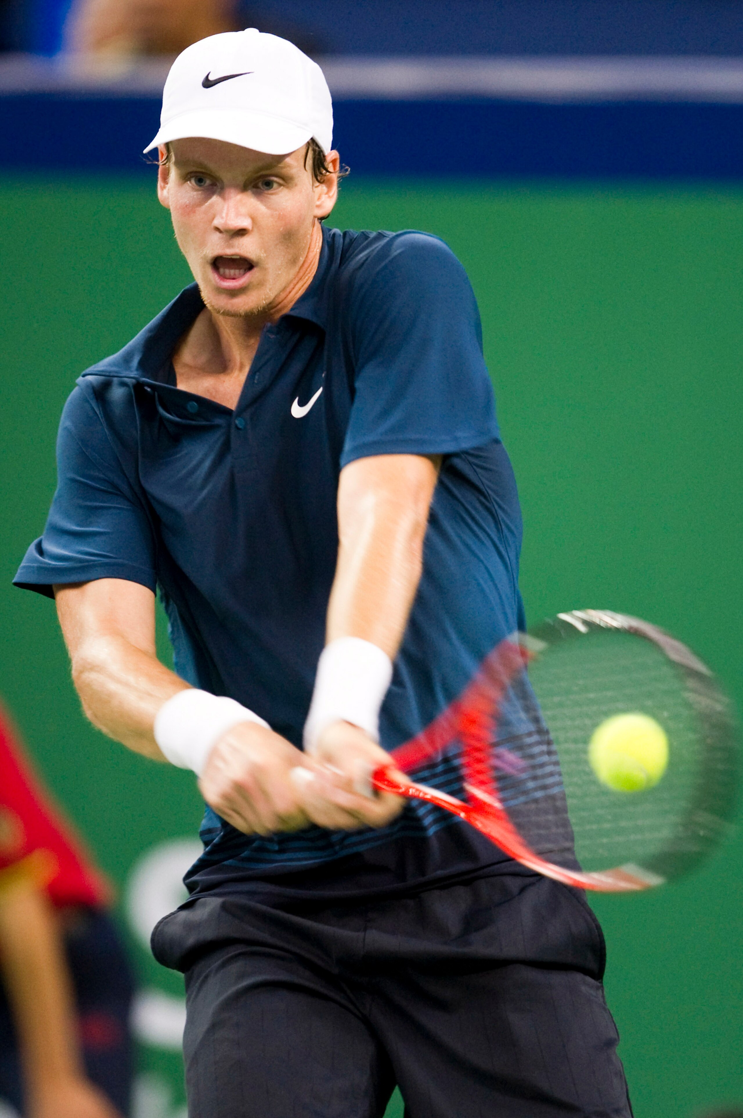 SHANGHAI, CHINA - OCTOBER 12: Tomas Berdych of Czech Republic returns a ball to Tommy Robredo of Spain during day two of the 2010 Shanghai Rolex Masters at the Shanghai Qi Zhong Tennis Center on October 12, 2010 in Shanghai, China. (Photo by Victor Frai SHANGHAI, CHINA - OCTOBER 12: Tomas Berdych of Czech Republic returns a ball to Tommy Robredo of Spain during day two of the 2010 Shanghai Rolex Masters at the Shanghai Qi Zhong Tennis Center on October 12, 2010 in Shanghai, China. (Photo by Victor Frai