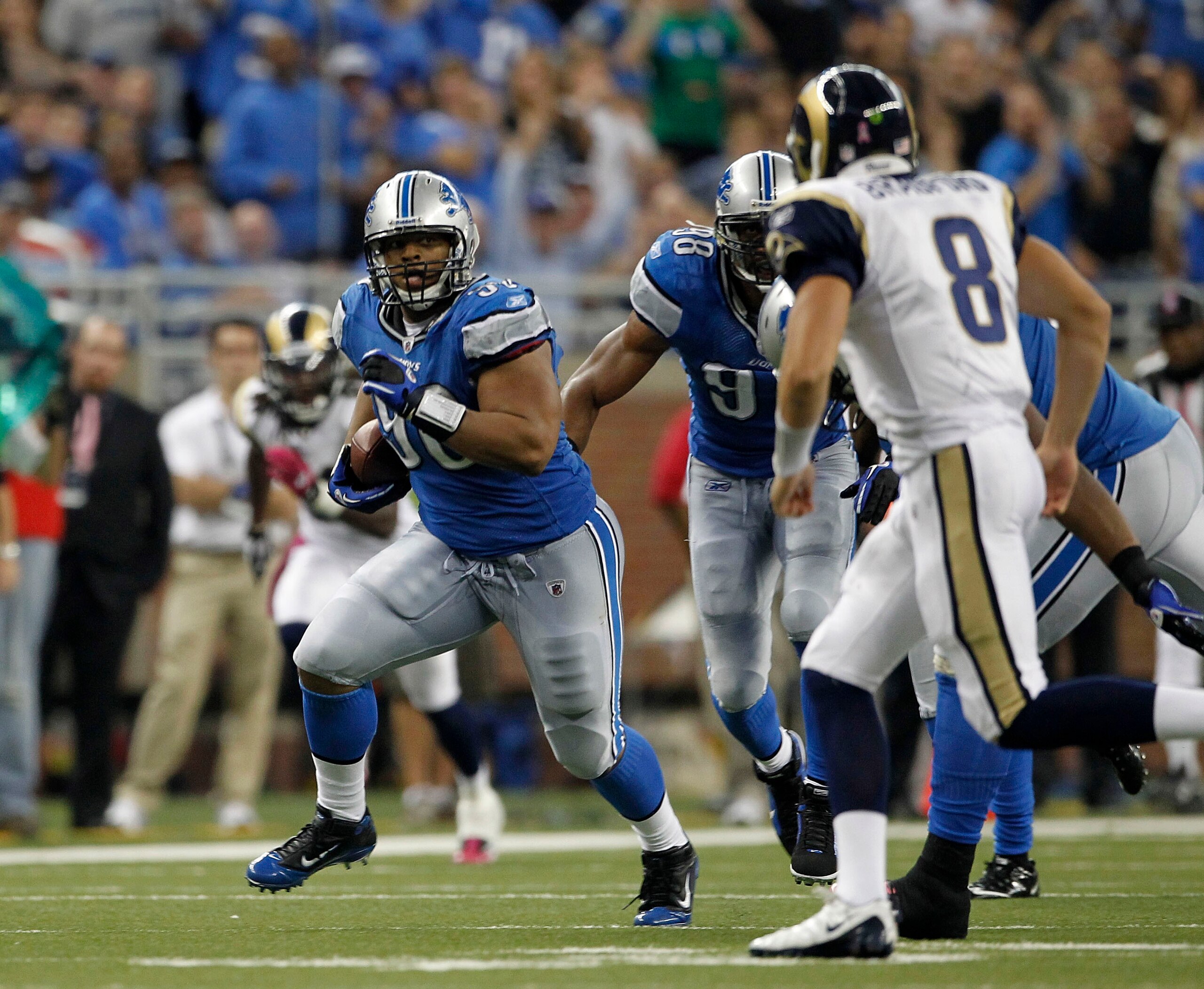 DETROIT - OCTOBER 10:  Ndamukong Suh #90 of the Detroit Lions intercepts the ball and runs it back during the fourth quarter of the game against the St. Louis Rams at Ford Field on October 10, 2010 in Detroit, Michigan.  The Lions defeated the Rams 44-6. 