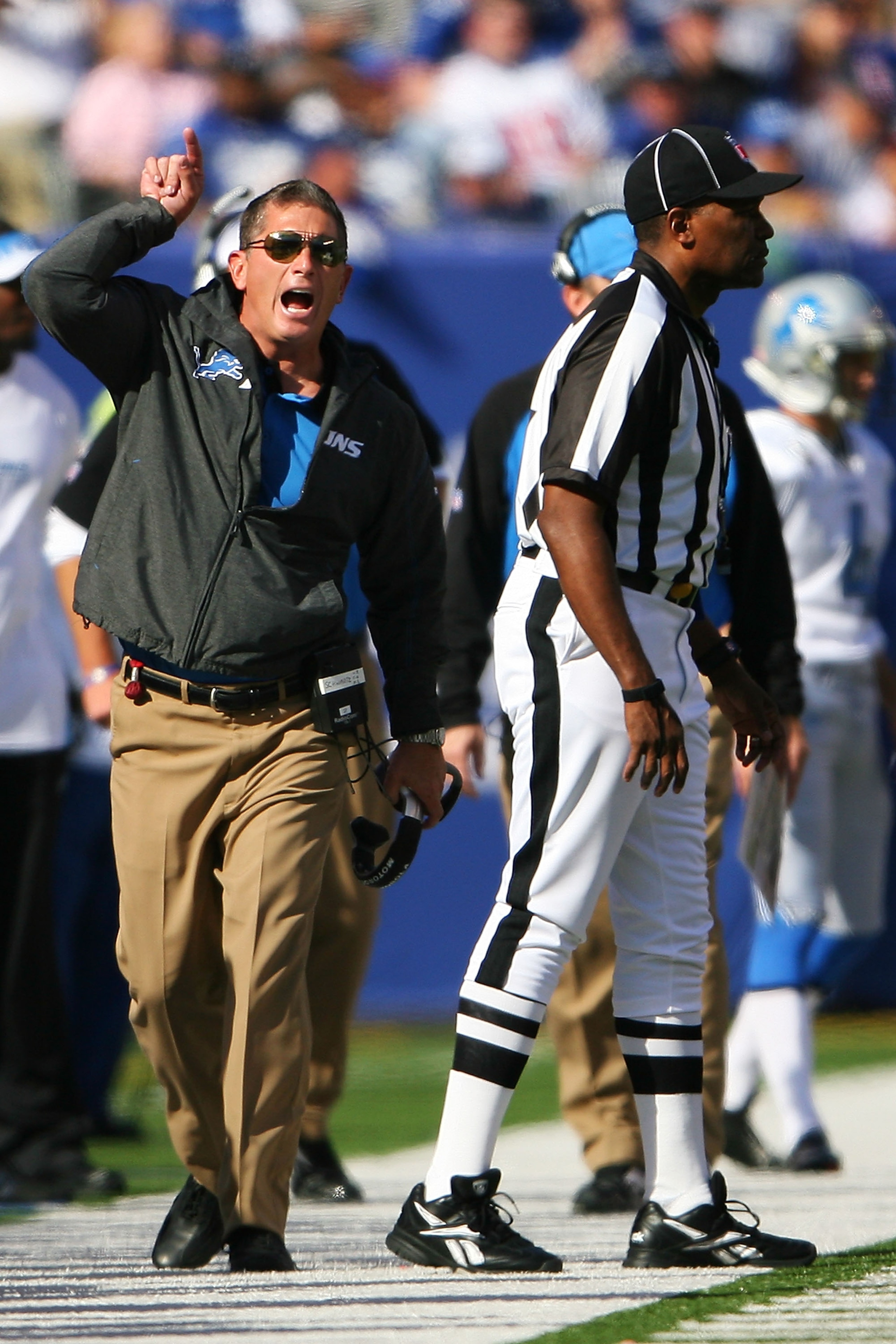 EAST RUTHERFORD, NJ - OCTOBER 17:  Jim Schwartz, head coach of the Detroit Lions screams after disagreeing with a referee call during a game against the New York Giants at New Meadowlands Stadium on October 17, 2010 in East Rutherford, New Jersey. The Gia