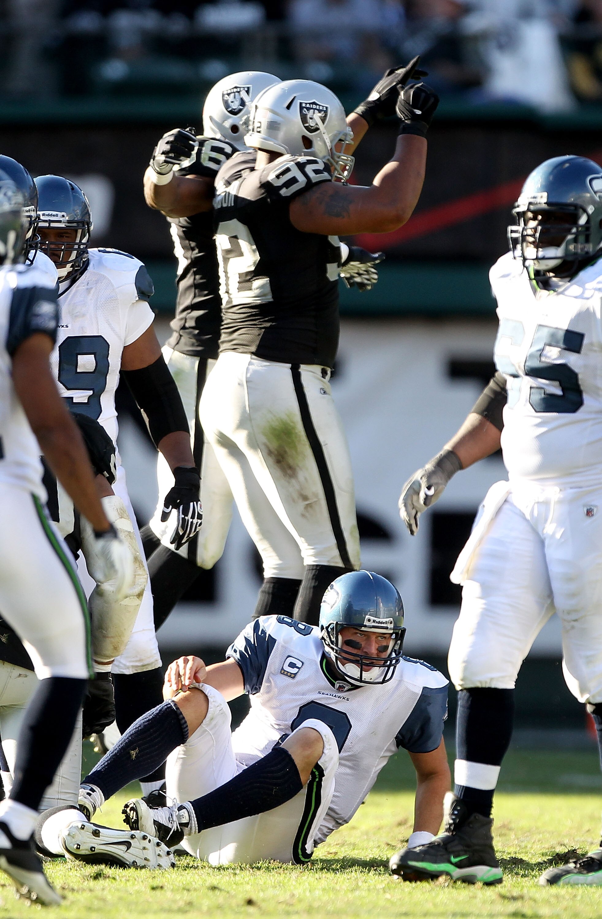 OAKLAND, CA - OCTOBER 31:  Matt Hasselbeck #8 of the Seattle Seahawks gets off the ground after he was sacked by Richard Seymour #92 of the Oakland Raiders at Oakland-Alameda County Coliseum on October 31, 2010 in Oakland, California.  (Photo by Ezra Shaw