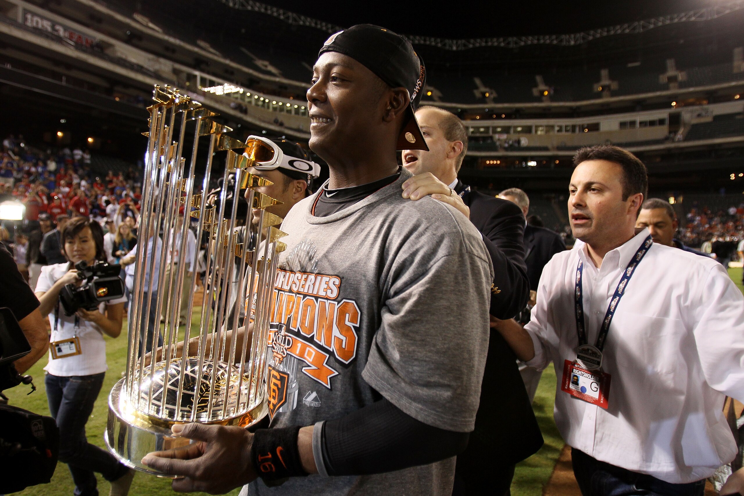 ARLINGTON, TX - NOVEMBER 01:  World Series MVP Edgar Renteria #16 of the San Francisco Giants celebrates on the field with the World Series Championship trophy after the Giants won 3-1 against the Texas Rangers in Game Five of the 2010 MLB World Series at
