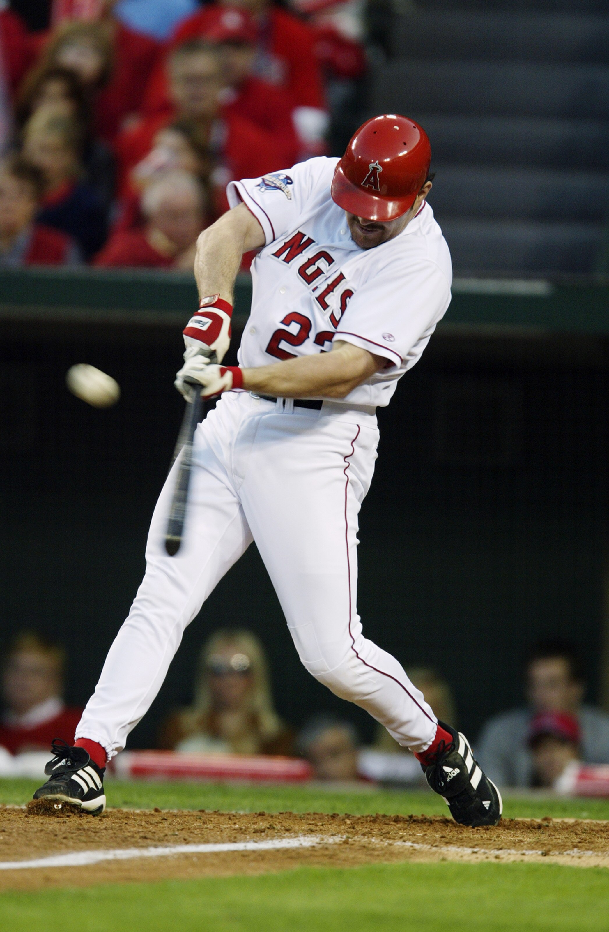 ANAHEIM, CA - OCTOBER 26:  First baseman Scott Spiezio #23 of the Anaheim Angels swing at the pitch in Game six of the 2002 World Series against the San Francisco Giants at Edison Field on October 26, 2002 in Anaheim, California. The Angels defeated the G
