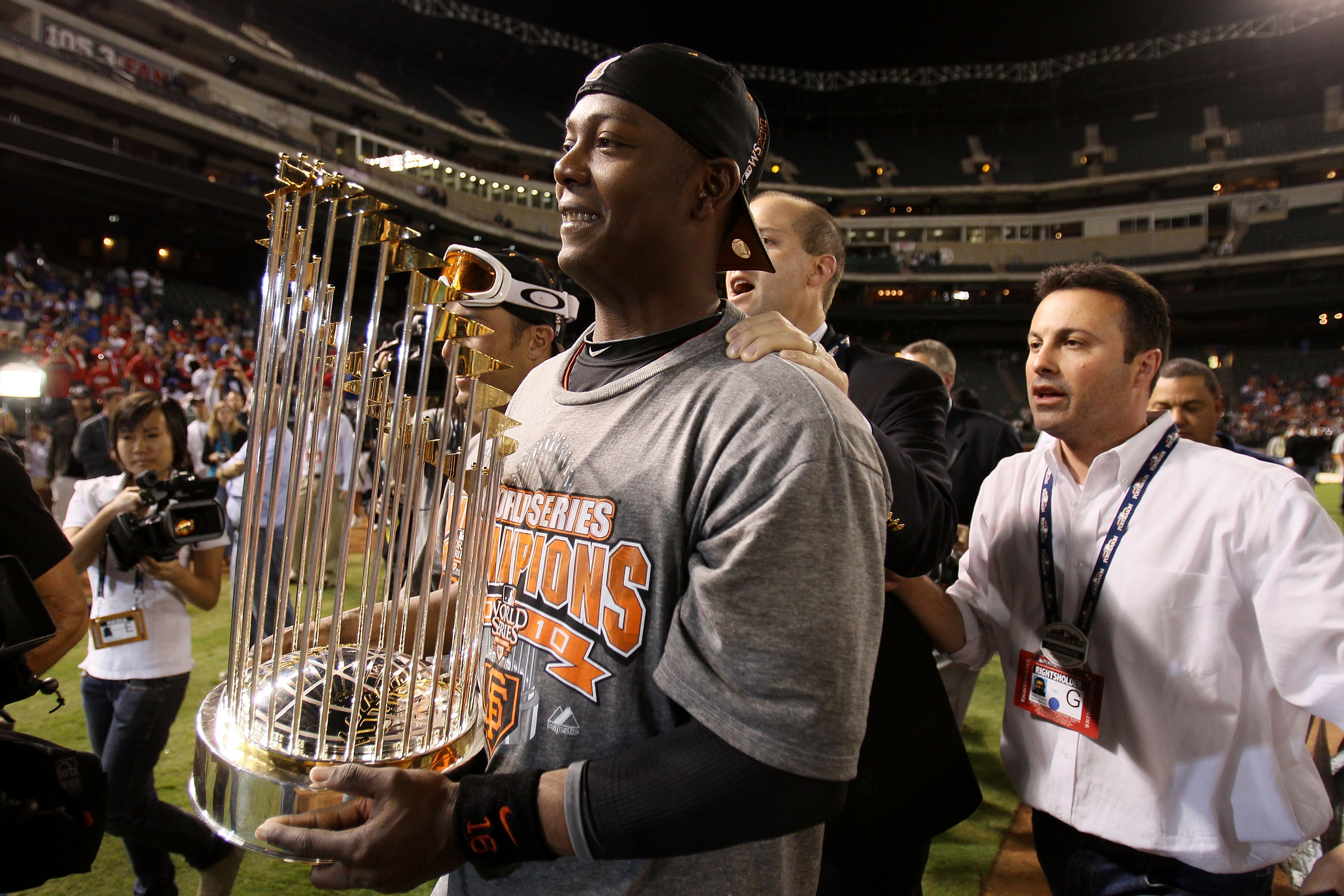 ARLINGTON, TX - NOVEMBER 01:  World Series MVP Edgar Renteria #16 of the San Francisco Giants celebrates on the field with the World Series Championship trophy after the Giants won 3-1 against the Texas Rangers in Game Five of the 2010 MLB World Series at