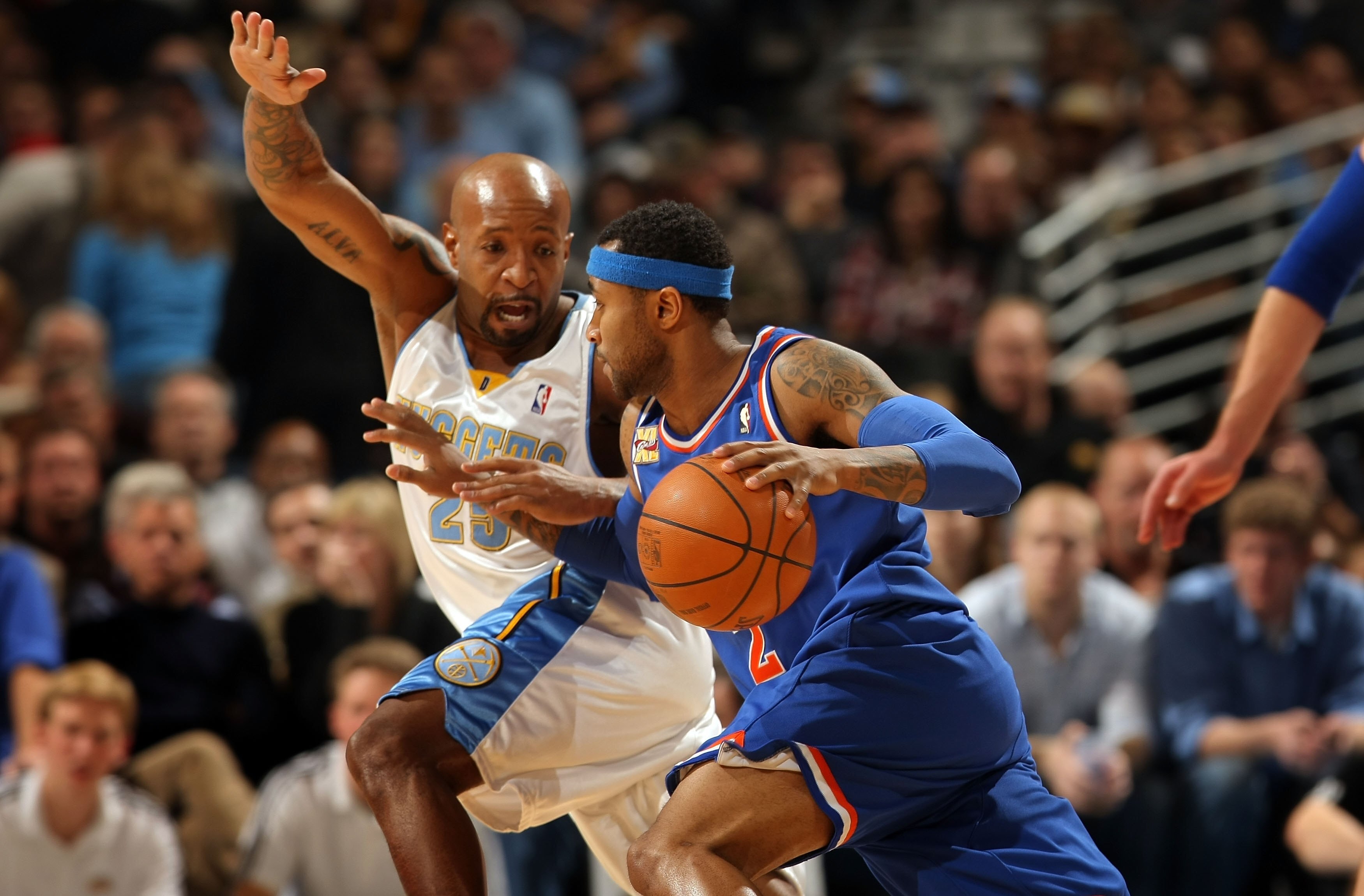 DENVER - JANUARY 08:  Mo Williams #2 of the Cleveland Cavaliers controls the ball against Anthony Carter #25 of the Denver Nuggets during NBA action at Pepsi Center on January 8, 2010 in Denver, Colorado. The Nuggets defeated the Cavaliers 99-97. NOTE TO 