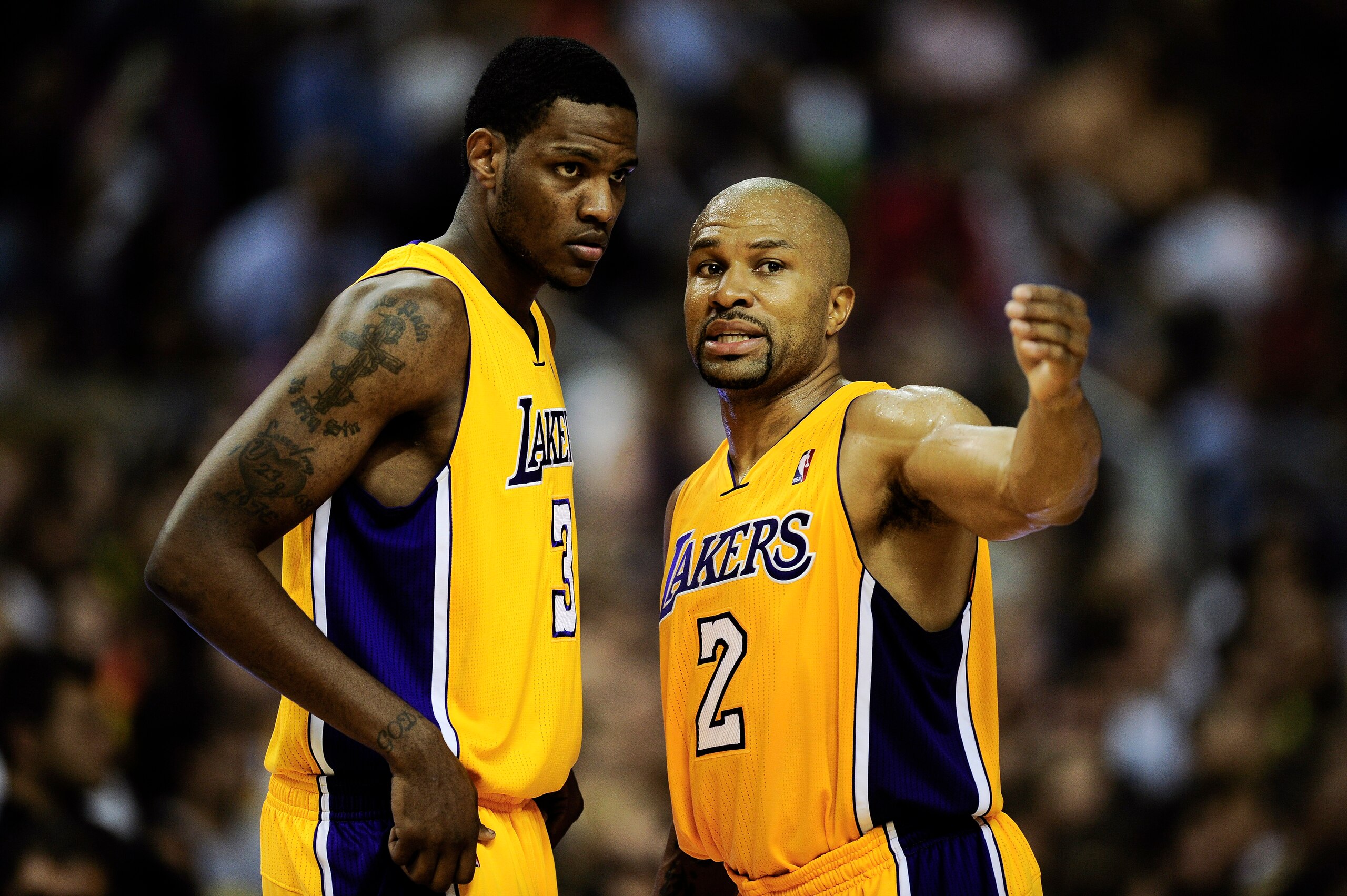 BARCELONA, SPAIN - OCTOBER 07: Devin Ebanks (L) #3 of the Los Angeles Lakers chats with his teammate Derek Fisher #2 during the NBA Europe Live match between Los Angeles Lakers and Regal FC Barcelona at the at Palau Blaugrana on October 7, 2010 in Barcel BARCELONA, SPAIN - OCTOBER 07: Devin Ebanks (L) #3 of the Los Angeles Lakers chats with his teammate Derek Fisher #2 during the NBA Europe Live match between Los Angeles Lakers and Regal FC Barcelona at the at Palau Blaugrana on October 7, 2010 in Barcel
