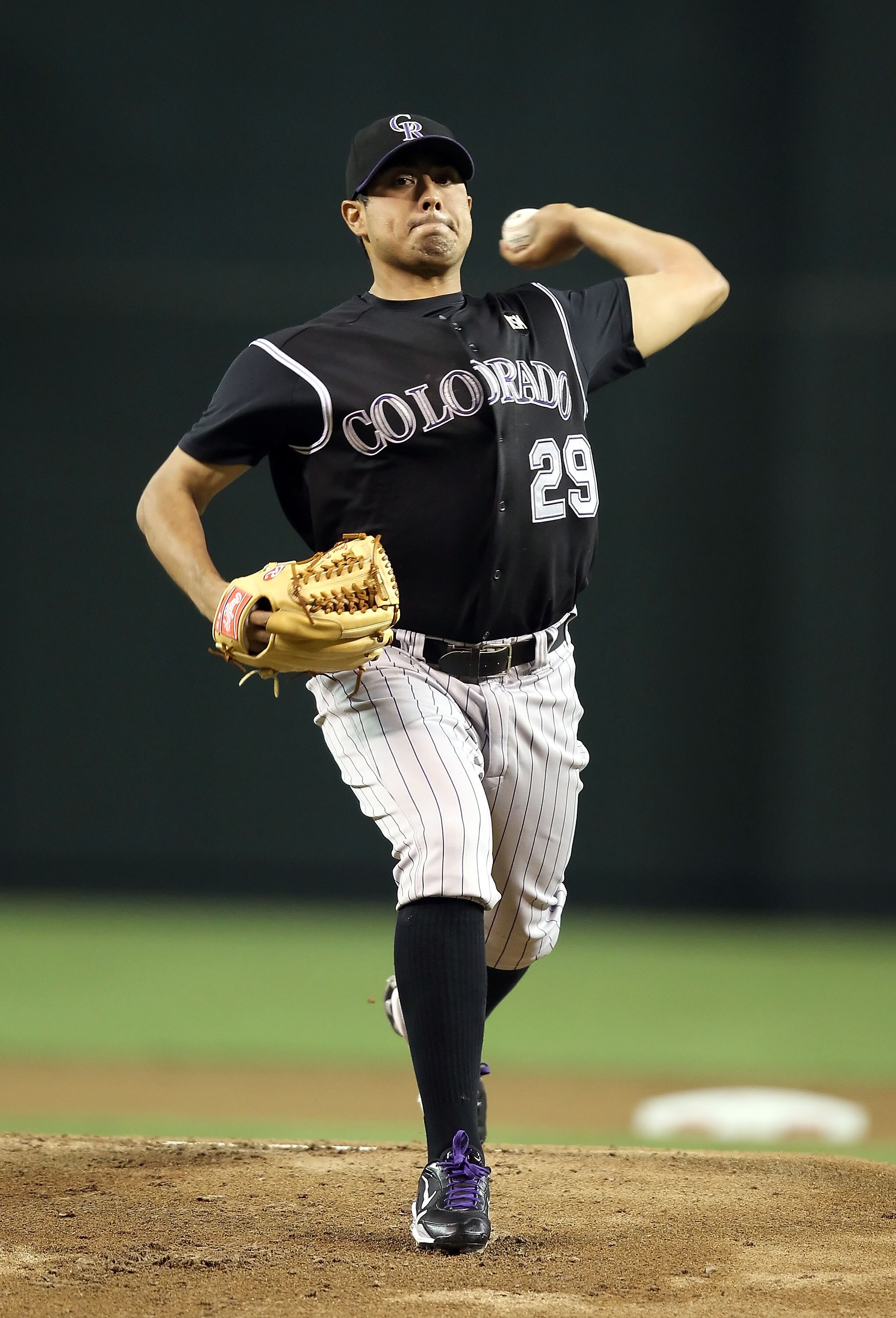 PHOENIX - SEPTEMBER 21:  Starting pitcher Jorge De La Rosa #29 of the Colorado Rockies pitches against the Arizona Diamondbacks during the Major League Baseball game at Chase Field on September 21, 2010 in Phoenix, Arizona.  (Photo by Christian Petersen/G