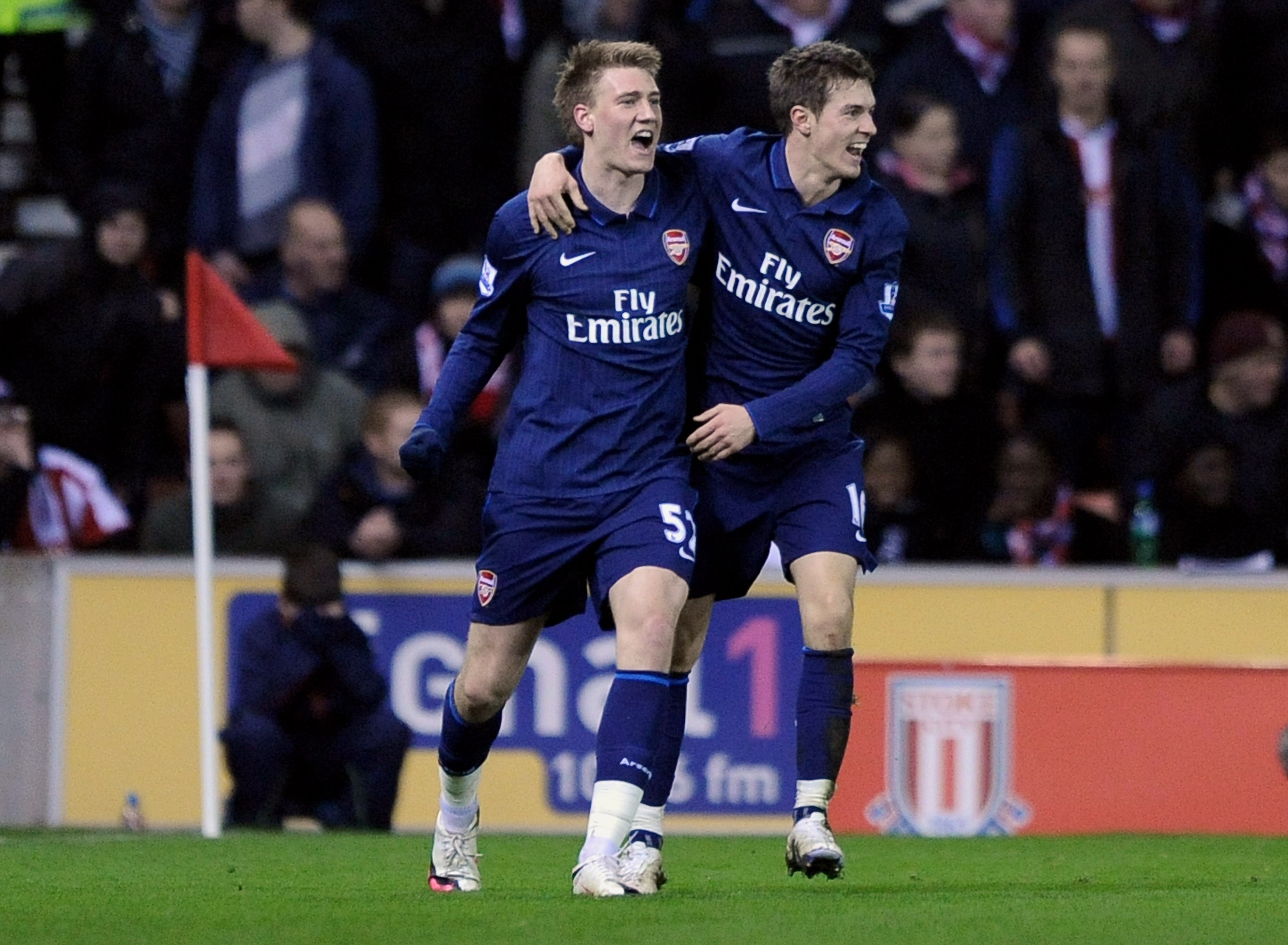 STOKE ON TRENT, ENGLAND - FEBRUARY 27:   Nicklas Bendtner (L) of Arsenal celebrates scoring his team's first goal with team mate Aaron Ramsey during the Barclays Premier League match between Stoke City and Arsenal at The Britannia Stadium on February 27,
