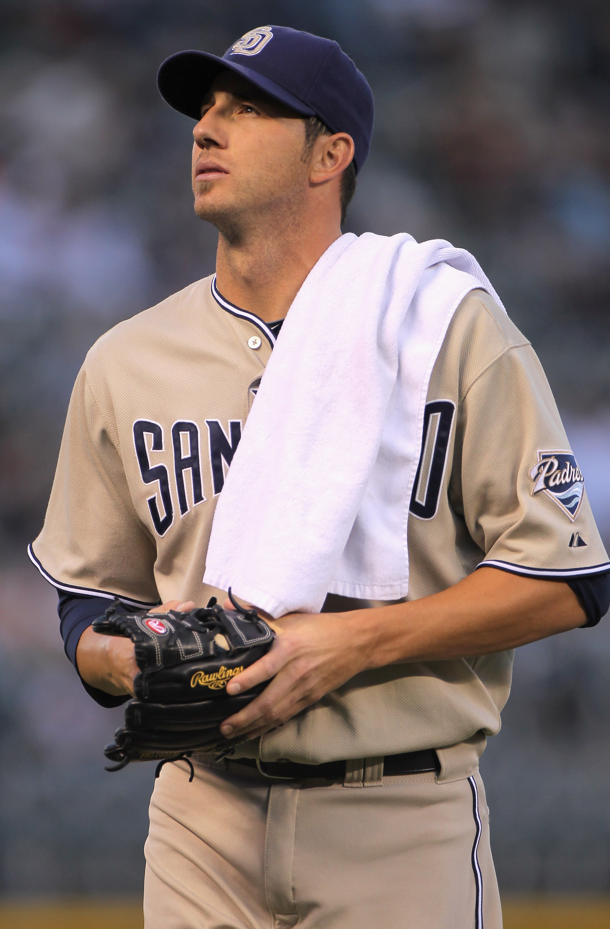 DENVER - SEPTEMBER 14: Starting pitcher Jon Garland #27 of the San Diego Padres heads for the dugout prior to facing the Colorado Rockies at Coors Field on September 14, 2010 in Denver, Colorado. Garland earned he win as the Padres defeated the Rockies 7 DENVER - SEPTEMBER 14: Starting pitcher Jon Garland #27 of the San Diego Padres heads for the dugout prior to facing the Colorado Rockies at Coors Field on September 14, 2010 in Denver, Colorado. Garland earned he win as the Padres defeated the Rockies 7