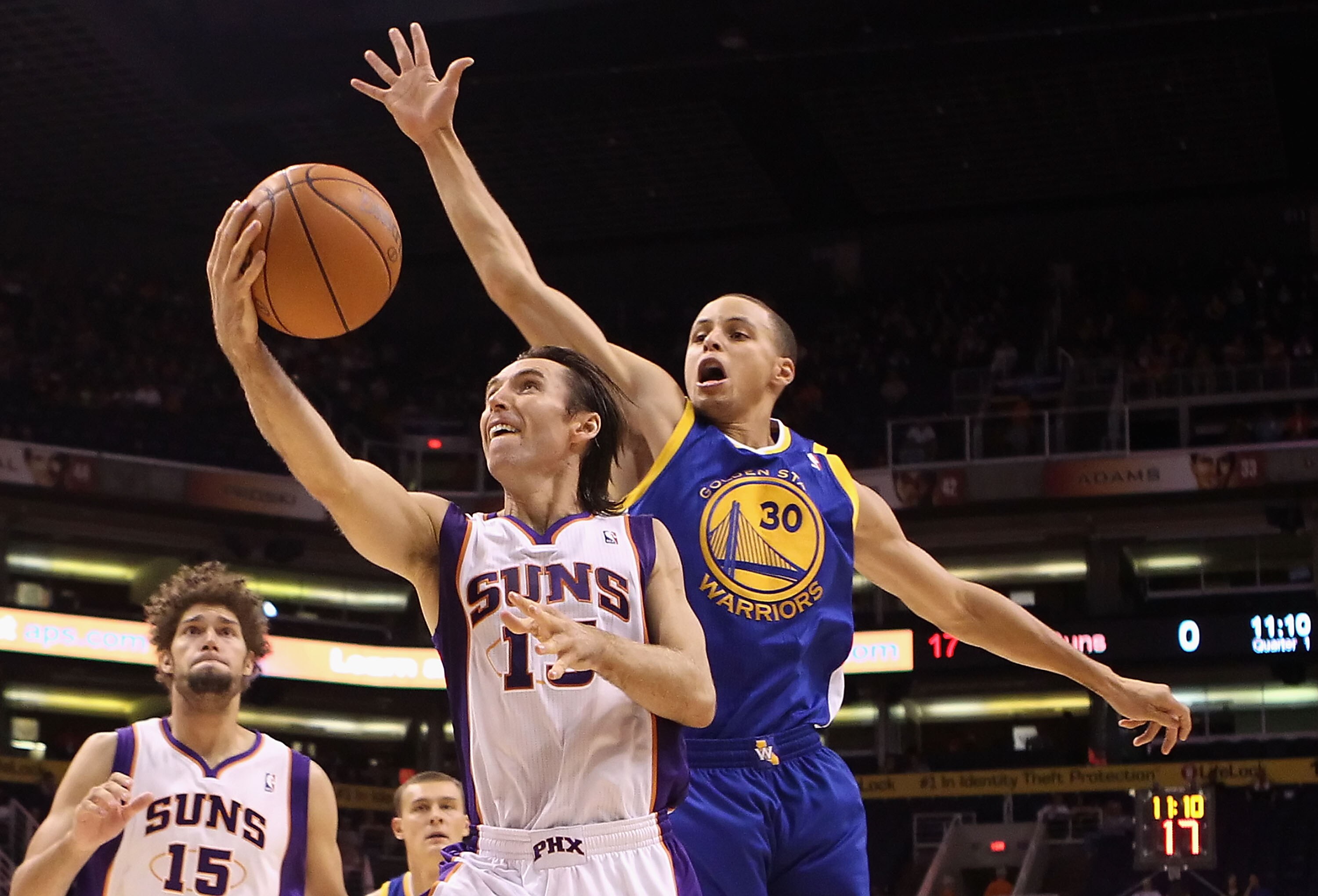 PHOENIX - OCTOBER 19:  Steve Nash #13 of the Phoenix Suns lays up a shot during the preseason NBA game against the Golden State Warriors at US Airways Center on October 19, 2010 in Phoenix, Arizona. NOTE TO USER: User expressly acknowledges and agrees tha