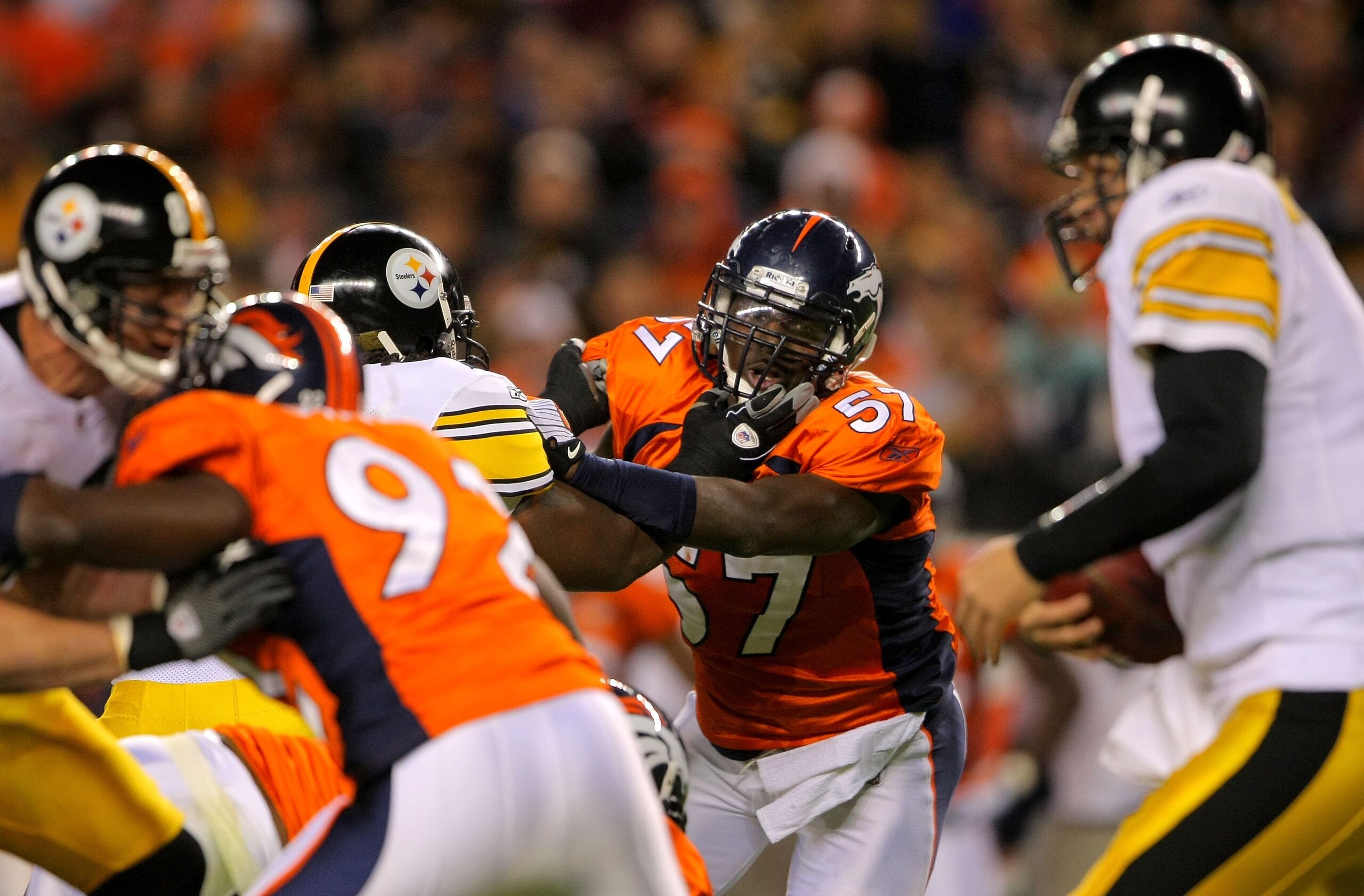 DENVER - NOVEMBER 09: Mario Haggan #57 of the Denver Broncos rushes quarterback Ben Roethlisberger #7 of the Pittsburgh Steelers on during NFL action at Invesco Field at Mile High on November 9, 2009 in Denver, Colorado. The Steelers defeated the Broncos DENVER - NOVEMBER 09: Mario Haggan #57 of the Denver Broncos rushes quarterback Ben Roethlisberger #7 of the Pittsburgh Steelers on during NFL action at Invesco Field at Mile High on November 9, 2009 in Denver, Colorado. The Steelers defeated the Broncos