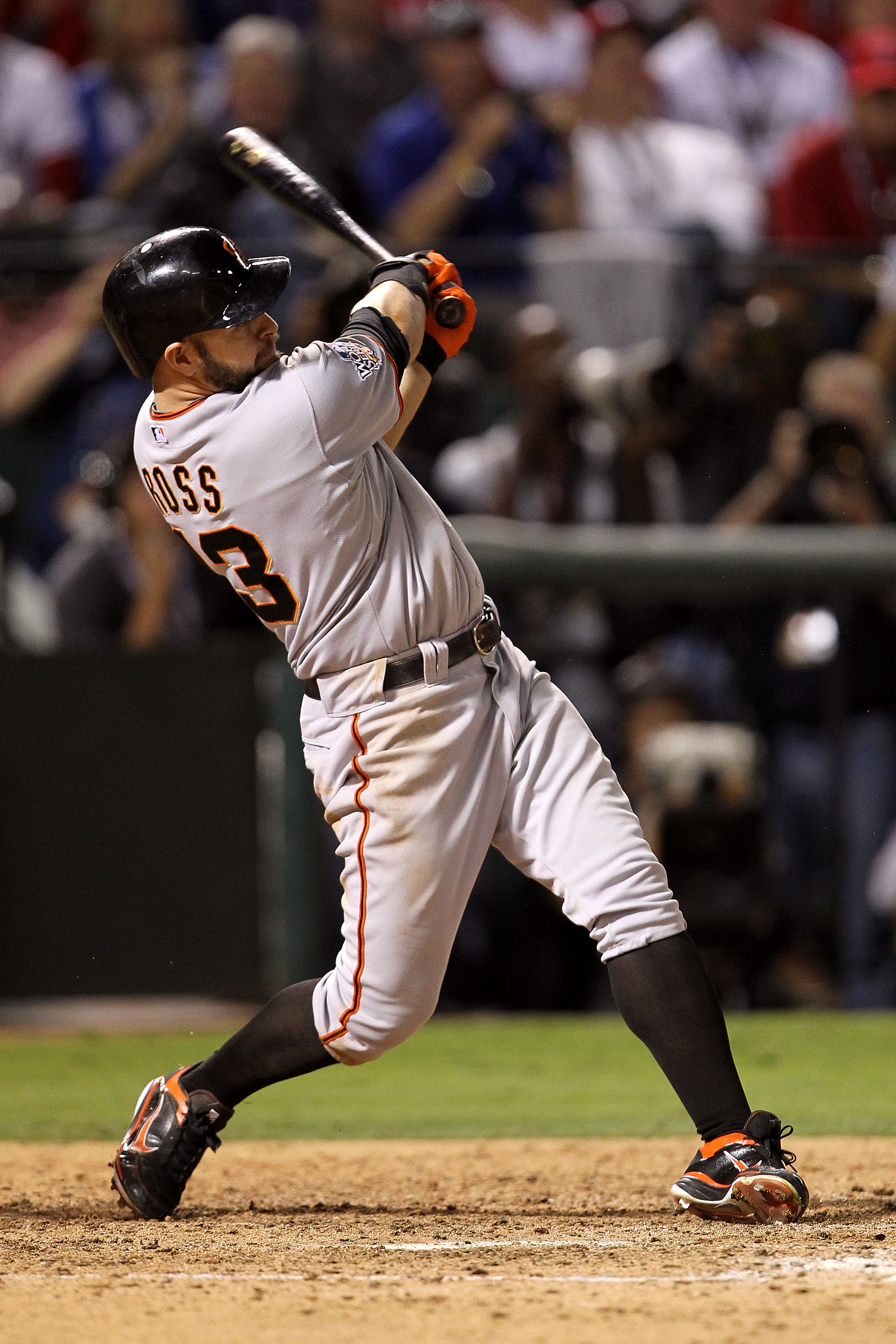 ARLINGTON, TX - OCTOBER 30:  Cody Ross #13 of the San Francisco Giants hits a solo home run in the top of the seventh inning against the Texas Rangers in Game Three of the 2010 MLB World Series at Rangers Ballpark in Arlington on October 30, 2010 in Arlin