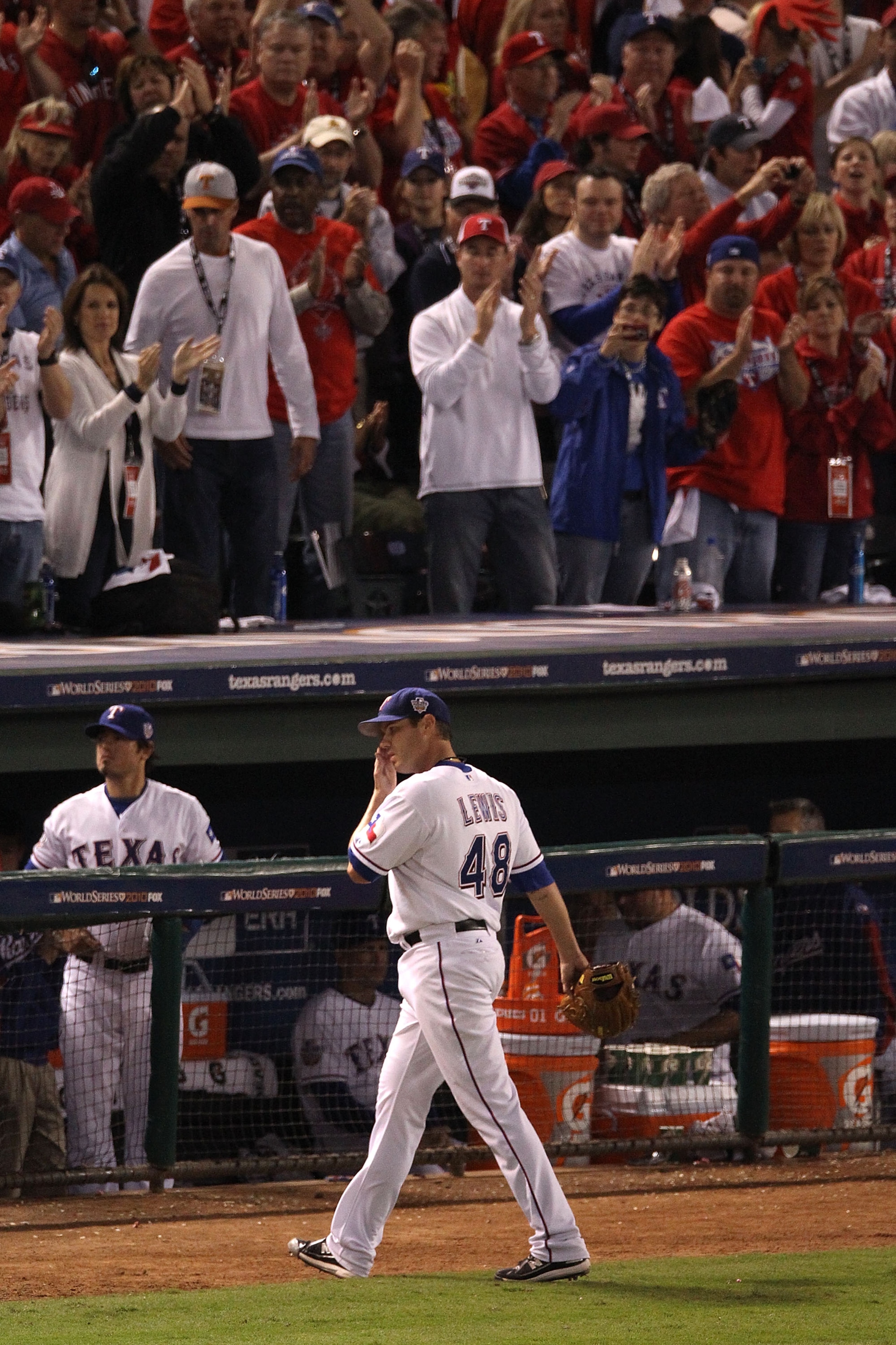 ARLINGTON, TX - OCTOBER 30:  Colby Lewis #48 of the Texas Rangers walks to the dugout in the eigth inning against the San Francisco Giants in Game Three of the 2010 MLB World Series at Rangers Ballpark in Arlington on October 30, 2010 in Arlington, Texas.