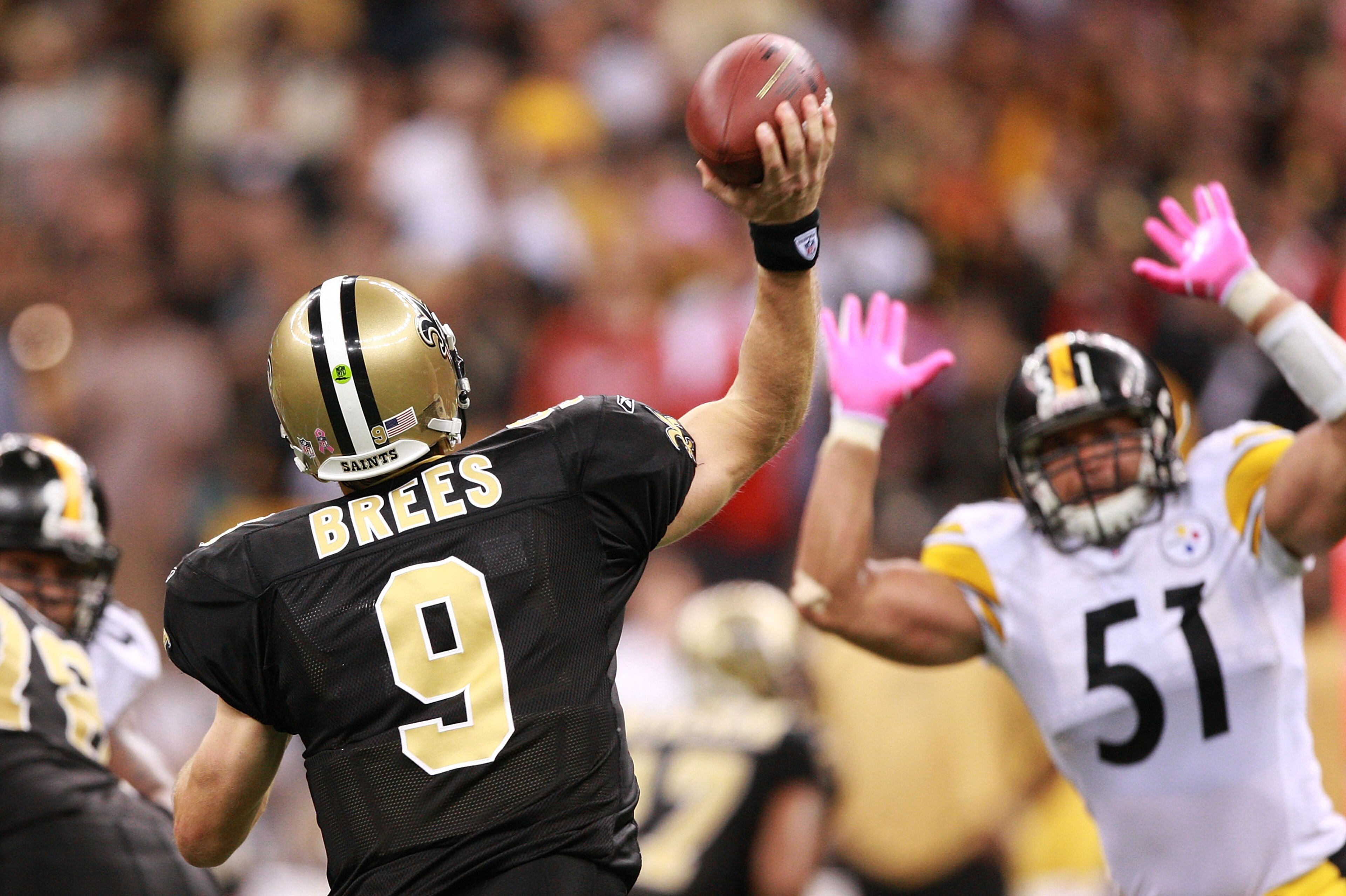 NEW ORLEANS - OCTOBER 31:  Drew Brees #9 of the New Orleans Saints passes over James Farrior #51 of the Pittsburgh Steelers during the game at Louisiana Superdome on October 31, 2010 in New Orleans, Louisiana.  The Saints won 20-10 over the Steelers.  (Ph