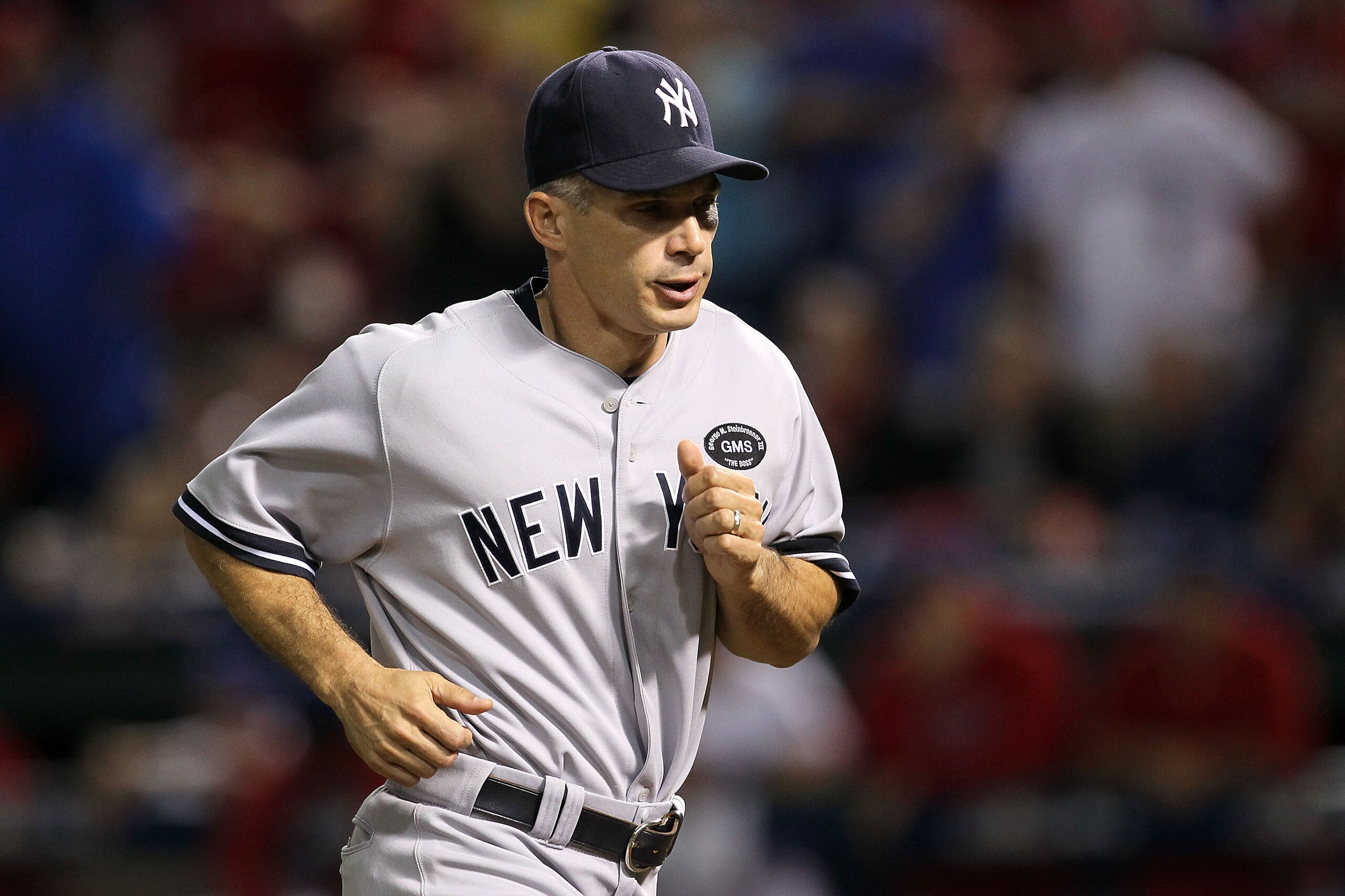 ARLINGTON, TX - OCTOBER 22: Manager Joe Girardi of the New York Yankees runs on the field in Game Six of the ALCS against the Texas Rangers during the 2010 MLB Playoffs at Rangers Ballpark in Arlington on October 22, 2010 in Arlington, Texas. (Photo by ARLINGTON, TX - OCTOBER 22: Manager Joe Girardi of the New York Yankees runs on the field in Game Six of the ALCS against the Texas Rangers during the 2010 MLB Playoffs at Rangers Ballpark in Arlington on October 22, 2010 in Arlington, Texas. (Photo by