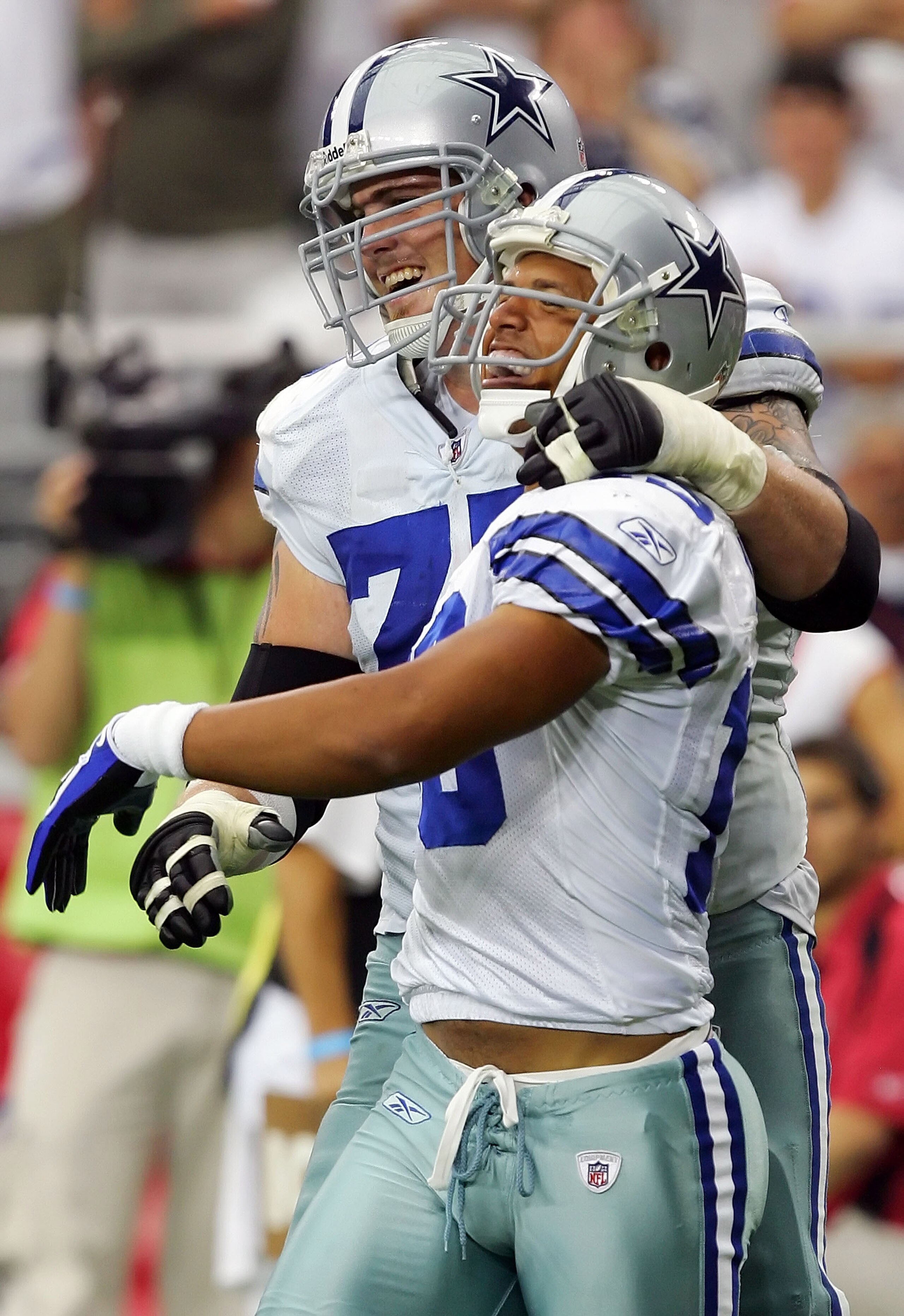 GLENDALE, AZ - OCTOBER 12: (L-R) Marc Columbo #75 and teammate Miles Austin #19 of the Dallas Cowboys celebrate during the game against the Arizona Cardinals at University of Phoenix Stadium on October 12, 2008 in Glendale, Arizona. (Photo by Lisa Blume GLENDALE, AZ - OCTOBER 12: (L-R) Marc Columbo #75 and teammate Miles Austin #19 of the Dallas Cowboys celebrate during the game against the Arizona Cardinals at University of Phoenix Stadium on October 12, 2008 in Glendale, Arizona. (Photo by Lisa Blume
