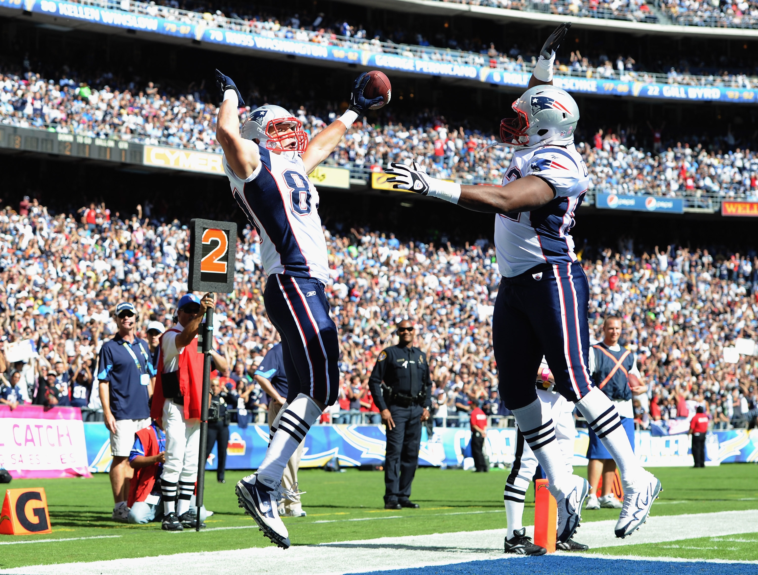 SAN DIEGO - OCTOBER 24:  Rob Gronkowski #87 of the New England Patriots celebrates his touchdown with Alge Crumpler #82 for a 7-3 lead over the San Diego Chargers during the first quarter at Qualcomm Stadium on October 24, 2010 in San Diego, California.  