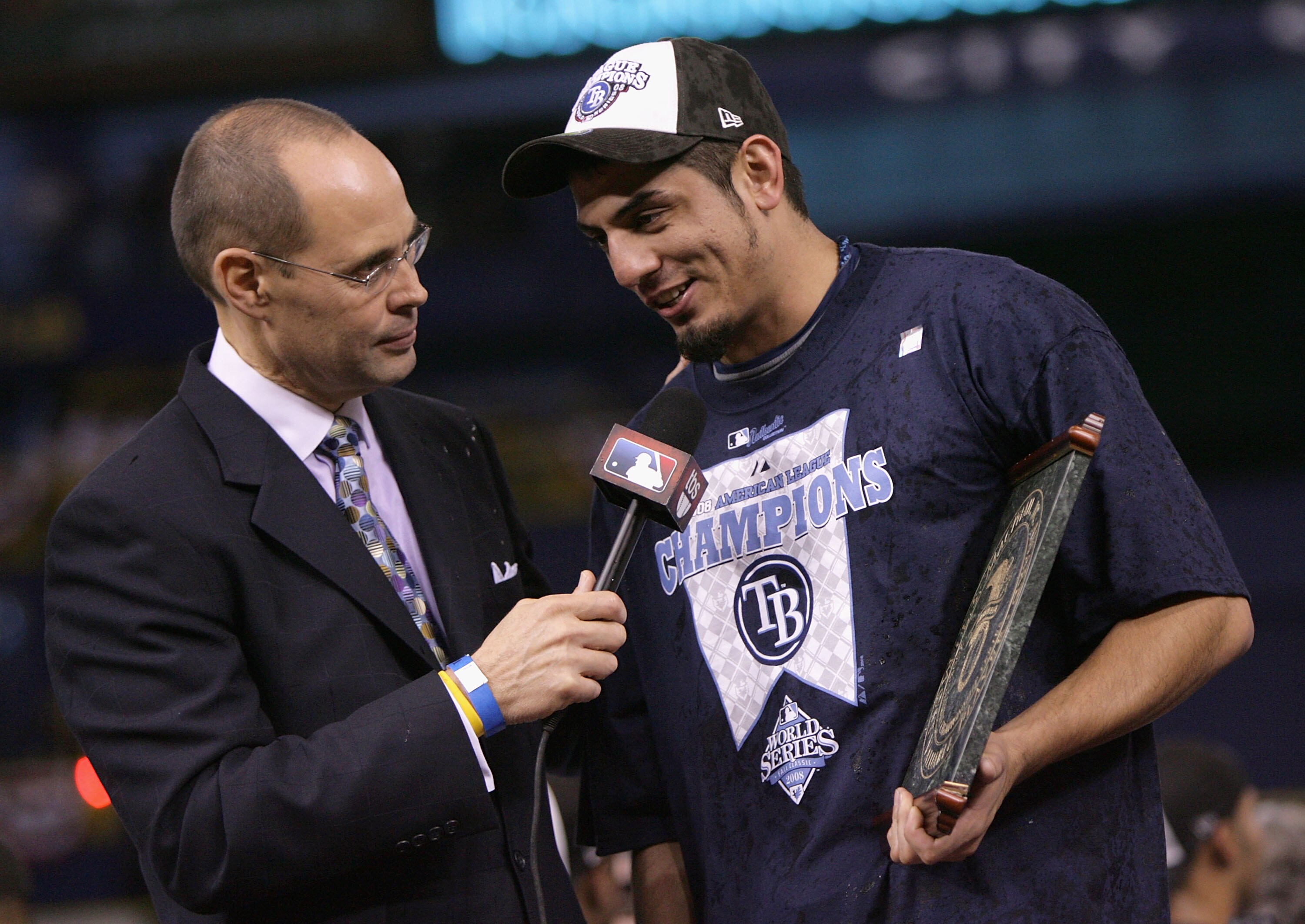 ST PETERSBURG, FL - OCTOBER 19:  Television personality Ernie Johnson talks with pitcher Matt Garza #22 of the Tampa Bay Rays after defeating the Boston Red Sox in game seven of the American League Championship Series during the 2008 MLB playoffs on Octob