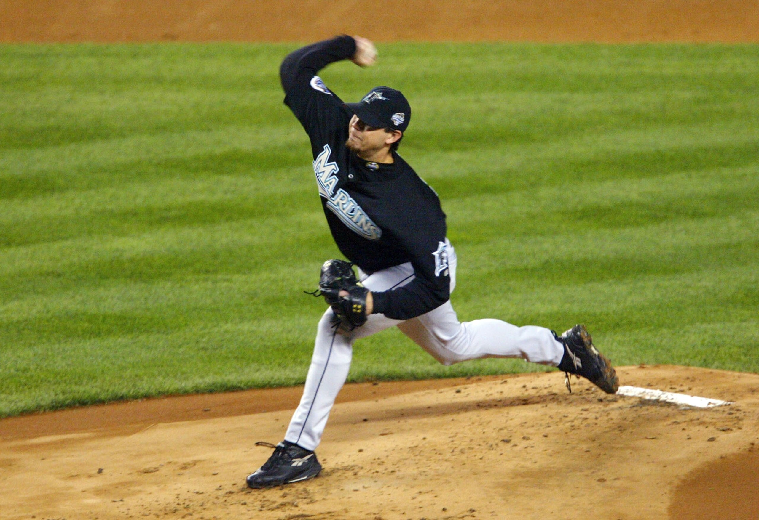 BRONX, NY - OCTOBER 25: Starting pitcher Josh Beckett #21 of the Florida Marlins throws a pitch against the New York Yankees in the first inning during game six of the Major League Baseball World Series on October 25, 2003 at Yankee Stadium in the Bronx, BRONX, NY - OCTOBER 25: Starting pitcher Josh Beckett #21 of the Florida Marlins throws a pitch against the New York Yankees in the first inning during game six of the Major League Baseball World Series on October 25, 2003 at Yankee Stadium in the Bronx,