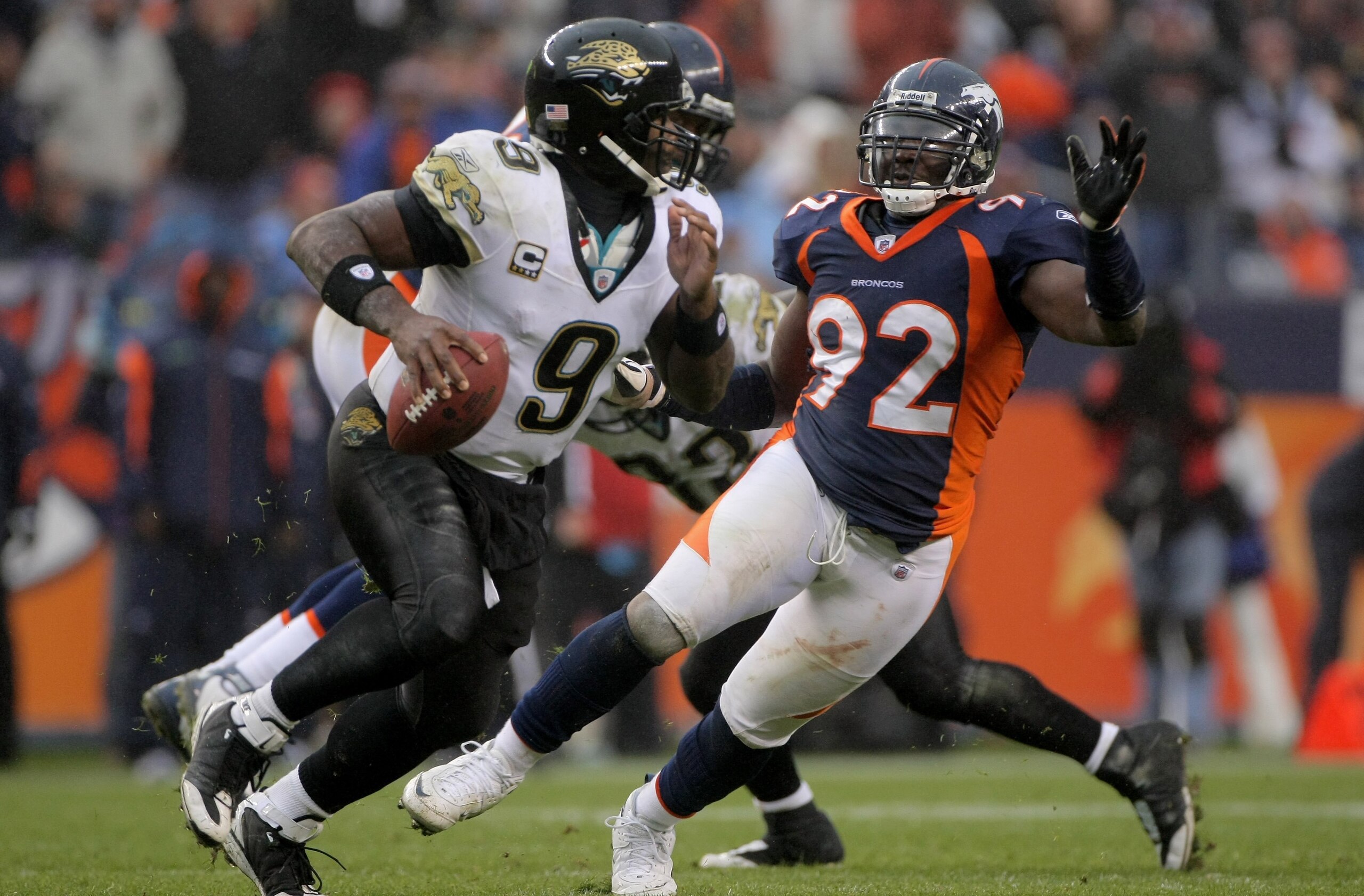DENVER - OCTOBER 12:  Defensive end  Elvis Dumervil #92 of the Denver Broncos pressures quarterback David Garrard #9 of the Jacksonville Jaguars during NFL action at Invesco Field at Mile High on October 12, 2008 in Denver, Colorado. The Jaguars defeated 
