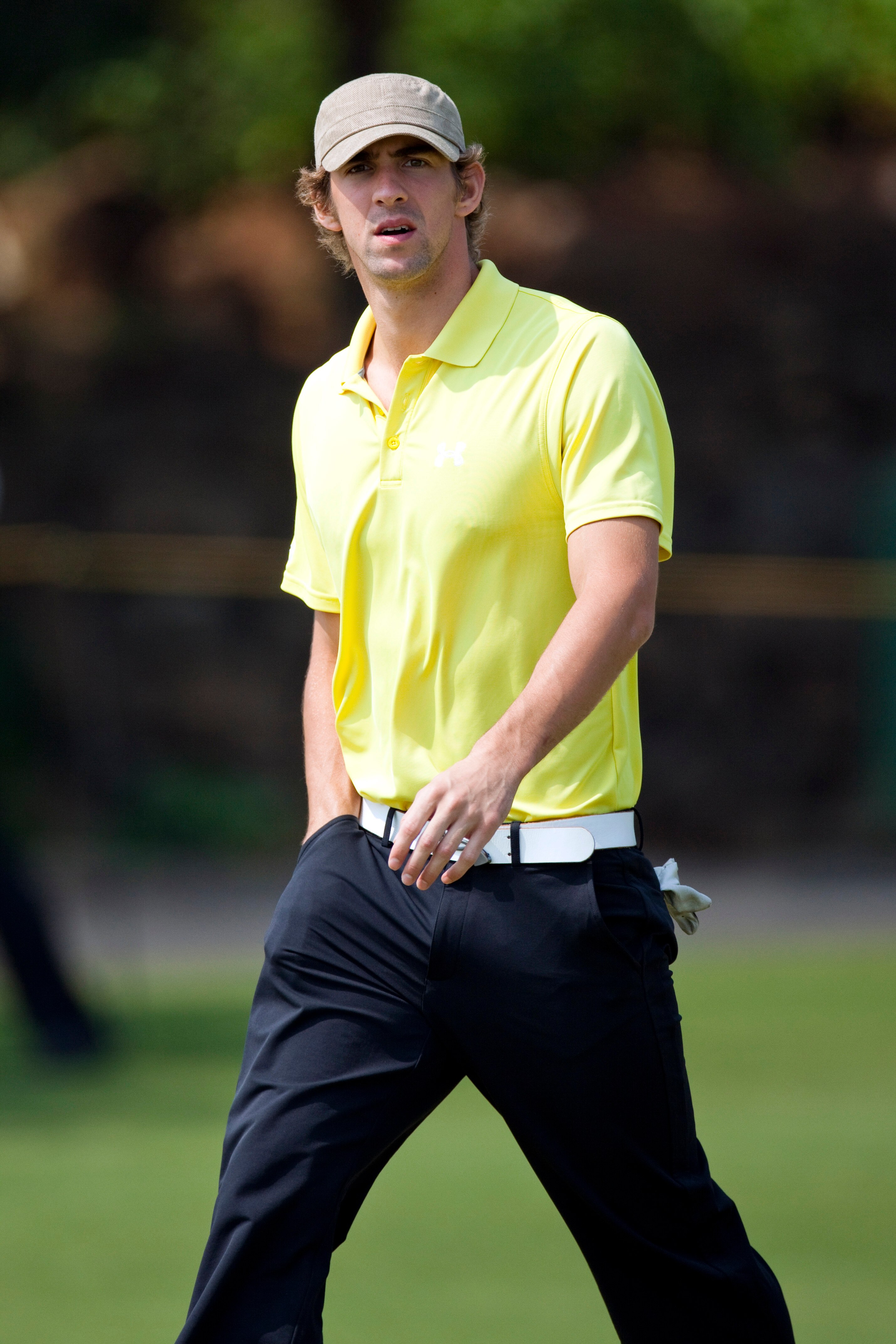 HAIKOU, CHINA - OCTOBER 29:  Olympic gold medalist Michael Phelps of USA reacts during day three of the Mission Hills Start Trophy tournament at Mission Hills Resort on October 29, 2010 in Haikou, China. The Mission Hills Star Trophy is Asia's leading lei