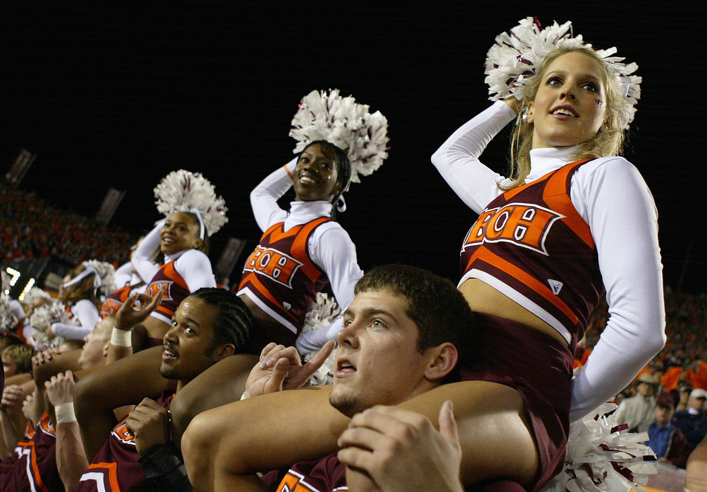BLACKSBURG, VA - NOVEMBER 18:  Viriginia Tech Hokies cheerleaders perform during NCAA action against the University of Maryland Terrapins at Lane Stadium November 18, 2004 in Blacksburg, Virginia.  (Photo by Doug Pensinger/Getty Images)