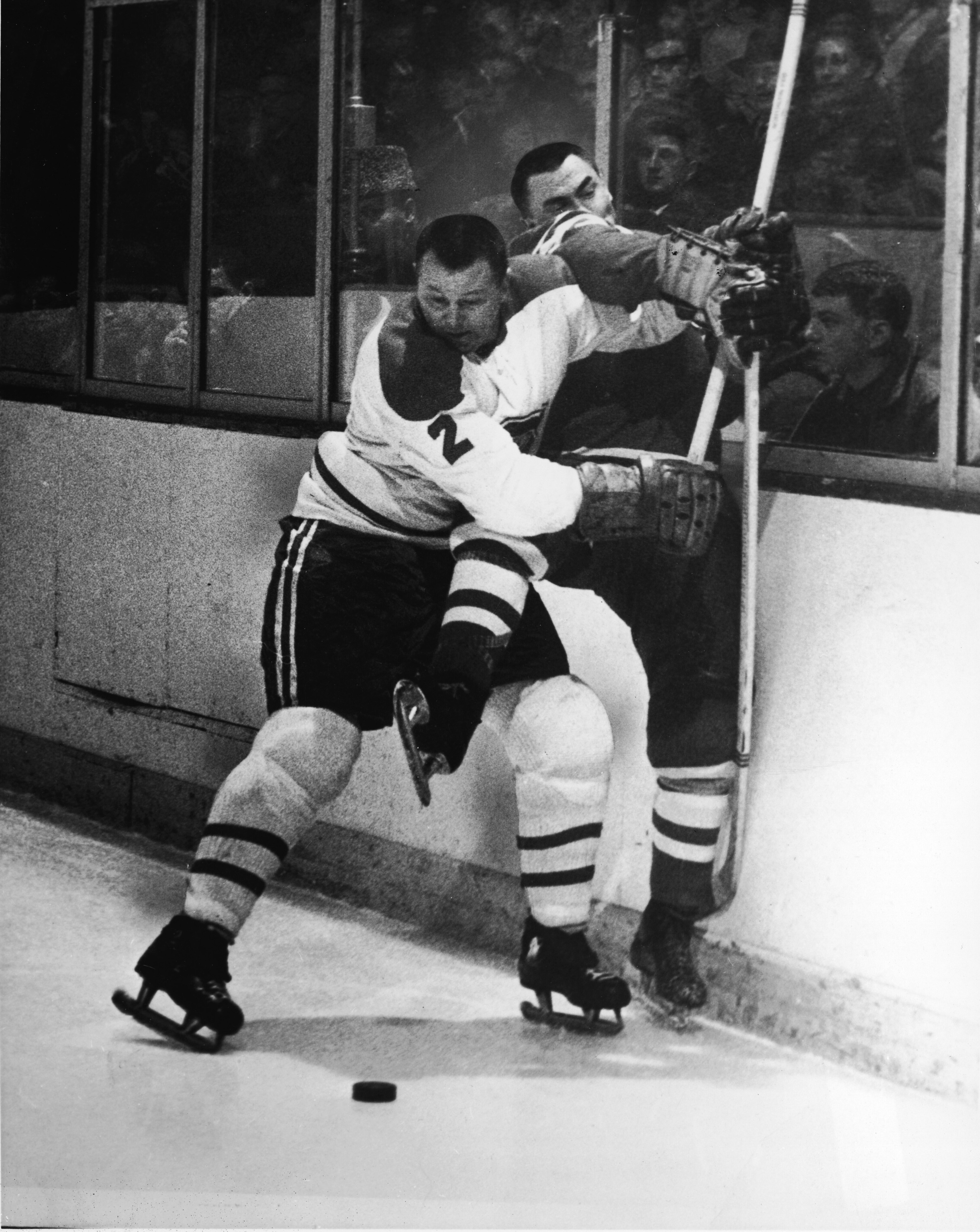 Canadian professional hockey player Doug Harvey of the Montreal Canadiens slams an opponent against the boards to keep him away from the puck, 1950s. (Photo by Pictorial Parade/Getty Images) Canadian professional hockey player Doug Harvey of the Montreal Canadiens slams an opponent against the boards to keep him away from the puck, 1950s. (Photo by Pictorial Parade/Getty Images)