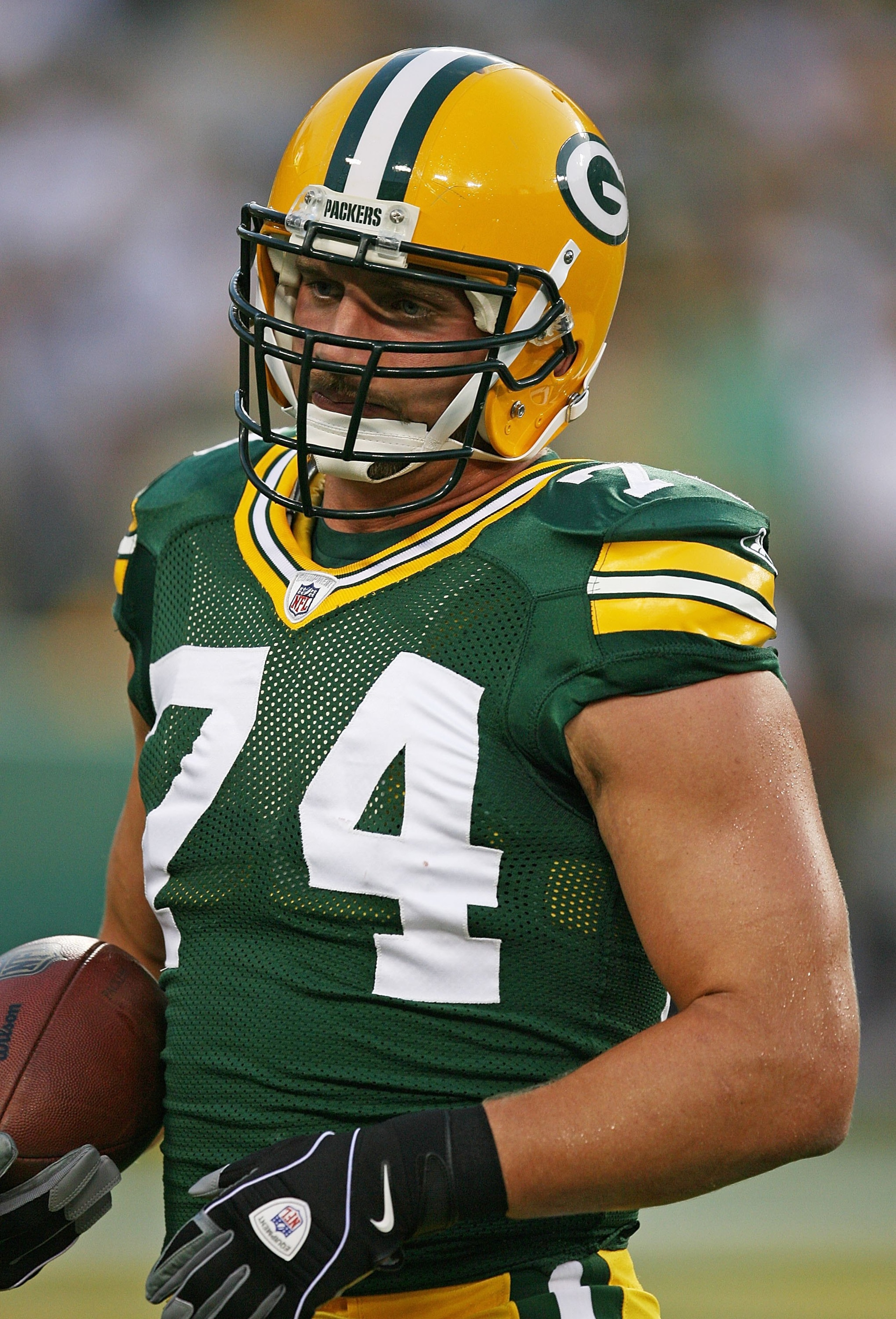 GREEN BAY, WI - SEPTEMBER 13: Aaron Kampman #74 of the Green Bay Packers participates in warm-ups before a game against the Chicago Bears on September 13, 2009 at Lambeau Field in Green Bay, Wisconsin. The Packers defeated the Bears 21-15.  (Photo by Jona