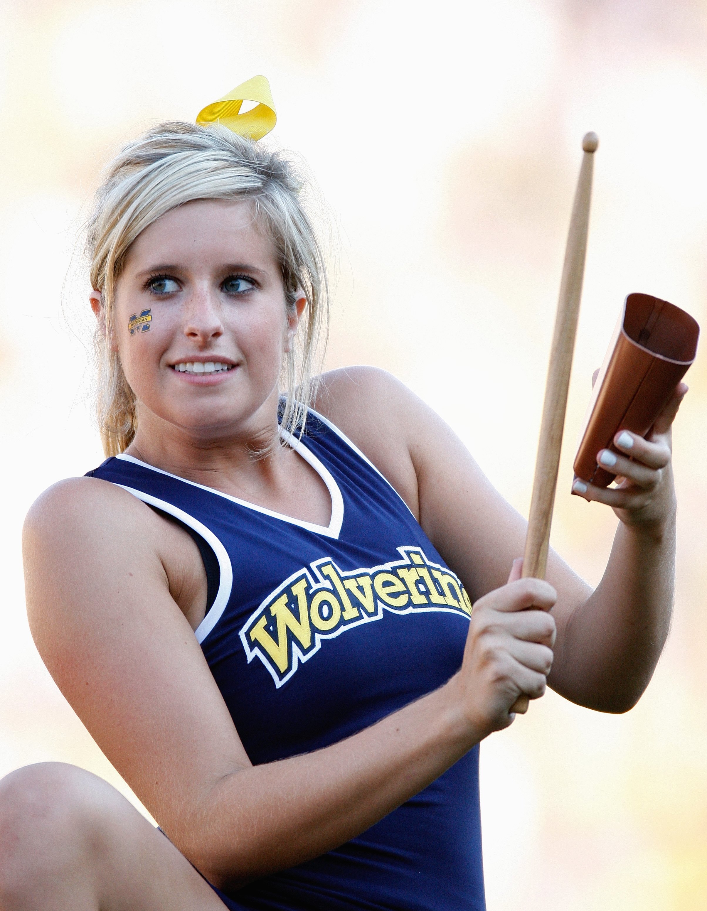 ANN ARBOR, MI - AUGUST 30:  A cheerleader of the Michigan Wolverines plays the cowbell during the game against the Utah Utes on August 30, 2008 at Michigan Stadium in Ann Arbor, Michigan. (Photo by: Gregory Shamus/Getty Images)