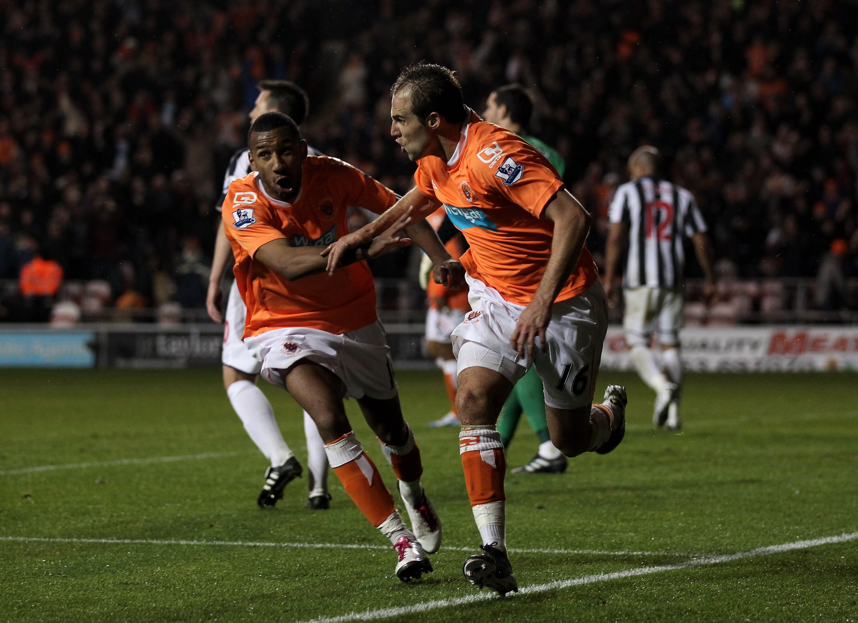 BLACKPOOL, ENGLAND - NOVEMBER 01:  Luke Varney of Blackpool celebrates scoring his team's second goal with team mate Elliot Grandin (L) during the Barclays Premier League match between Blackpool and West Bromwich Albion at Bloomfield Road on November 1, 2