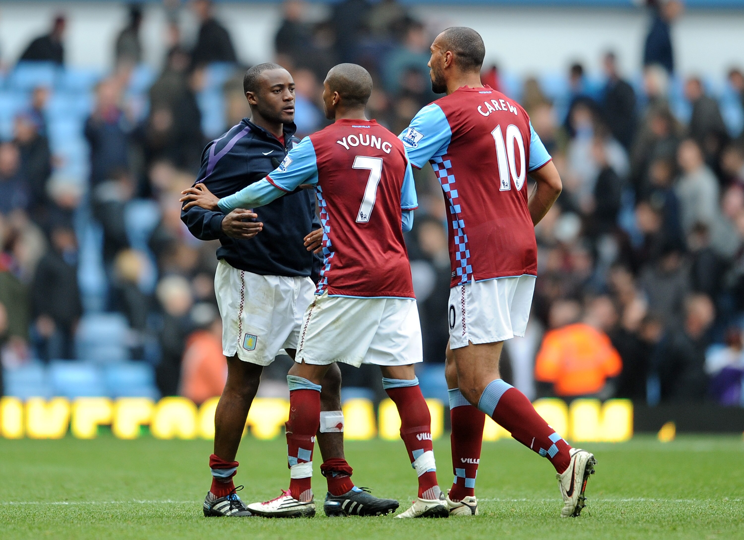 BIRMINGHAM, ENGLAND - OCTOBER 31:  Nigel Reo-Coker of Aston Villa is restrained by team-mates Ashley Young and John Carew following the Barclays Premier League match between Aston Villa and Birmingham City at Villa Park on October 31, 2010 in Birmingham,