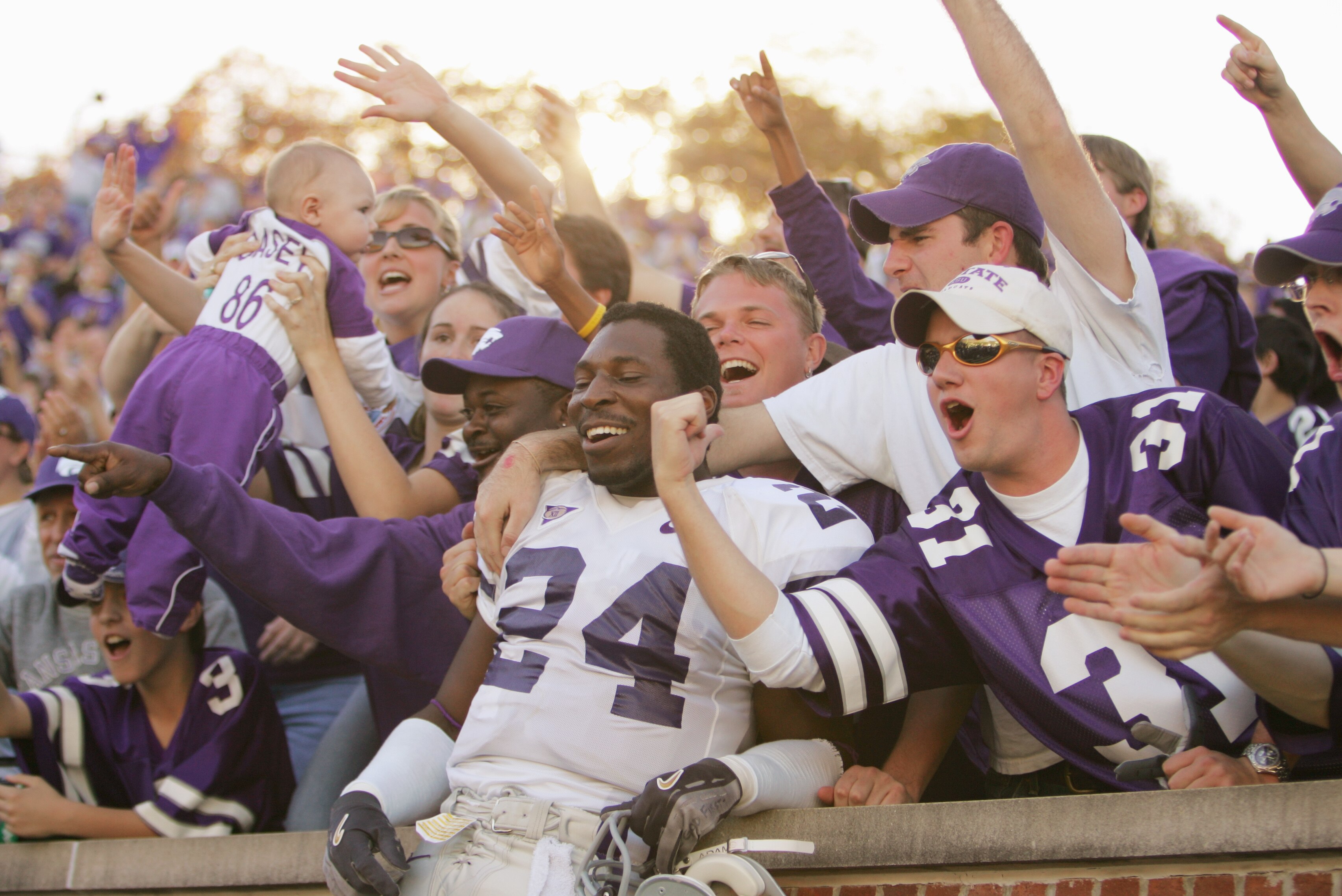 COLUMBIA, MO - NOVEMBER 6:  Defensive back Maurice Mack #24 of the Kansas State University Wildcats celebrates with fans after defeating the University of Missouri Tigers on November 6, 2004 at Faurot Field in Columbia, Missouri. Kansas State defeated Mis