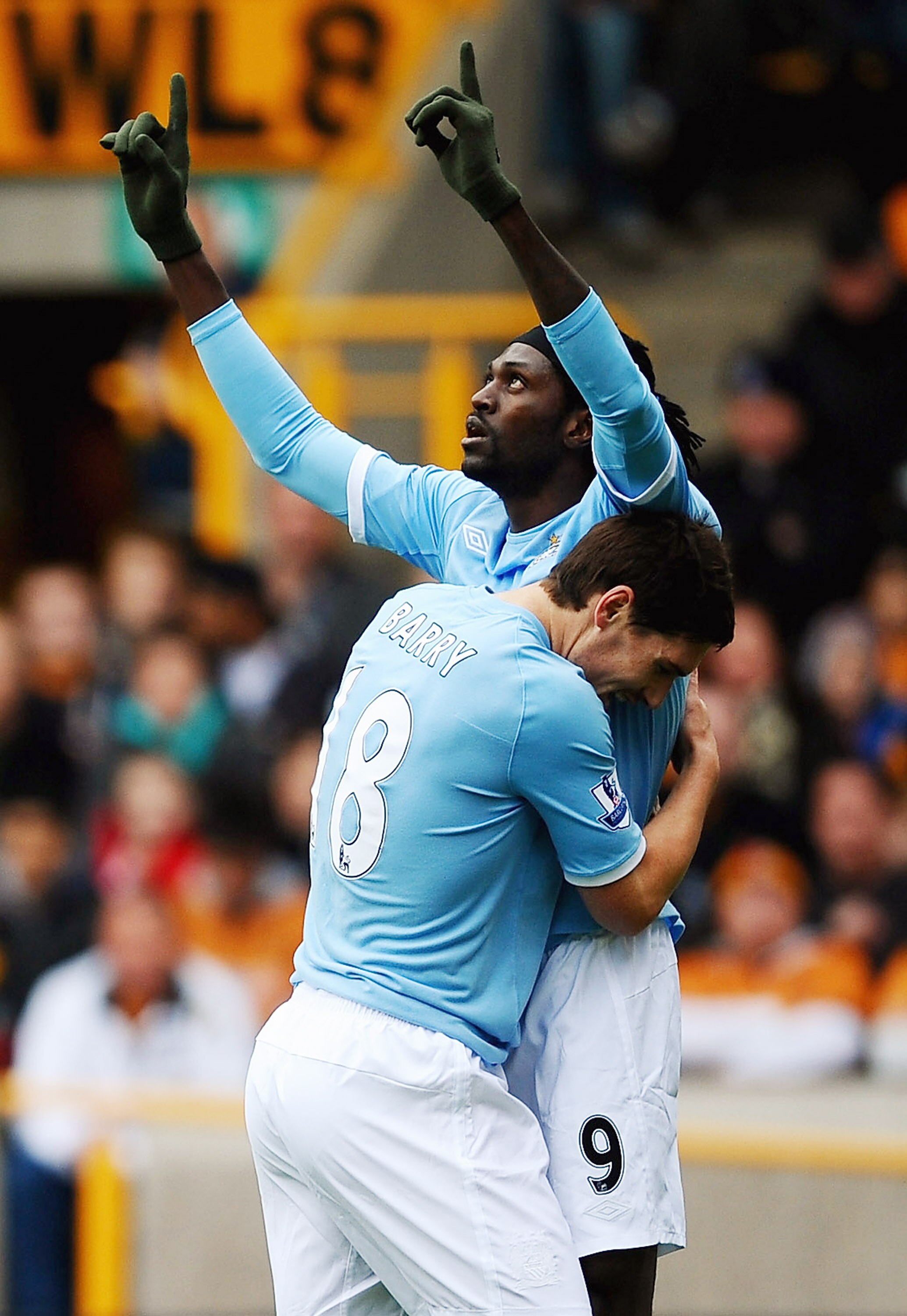 WOLVERHAMPTON, ENGLAND - OCTOBER 30:  Emmanuel Adebayor of Manchester City is congratulated on his spot kick by Gareth Barry during the Barclays Premier League match between Wolverhampton Wanderers and Manchester City at Molineux on October 30, 2010 in Wo