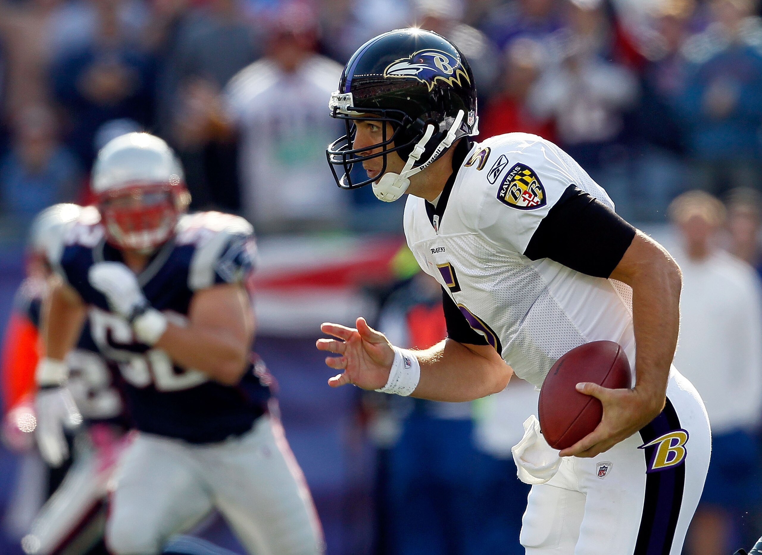 FOXBORO, MA - OCTOBER 17:  Joe Flacco #5 of the Baltimore Ravens runs against the New England Patriots at Gillette Stadium on October 17, 2010 in Foxboro, Massachusetts. (Photo by Jim Rogash/Getty Images)