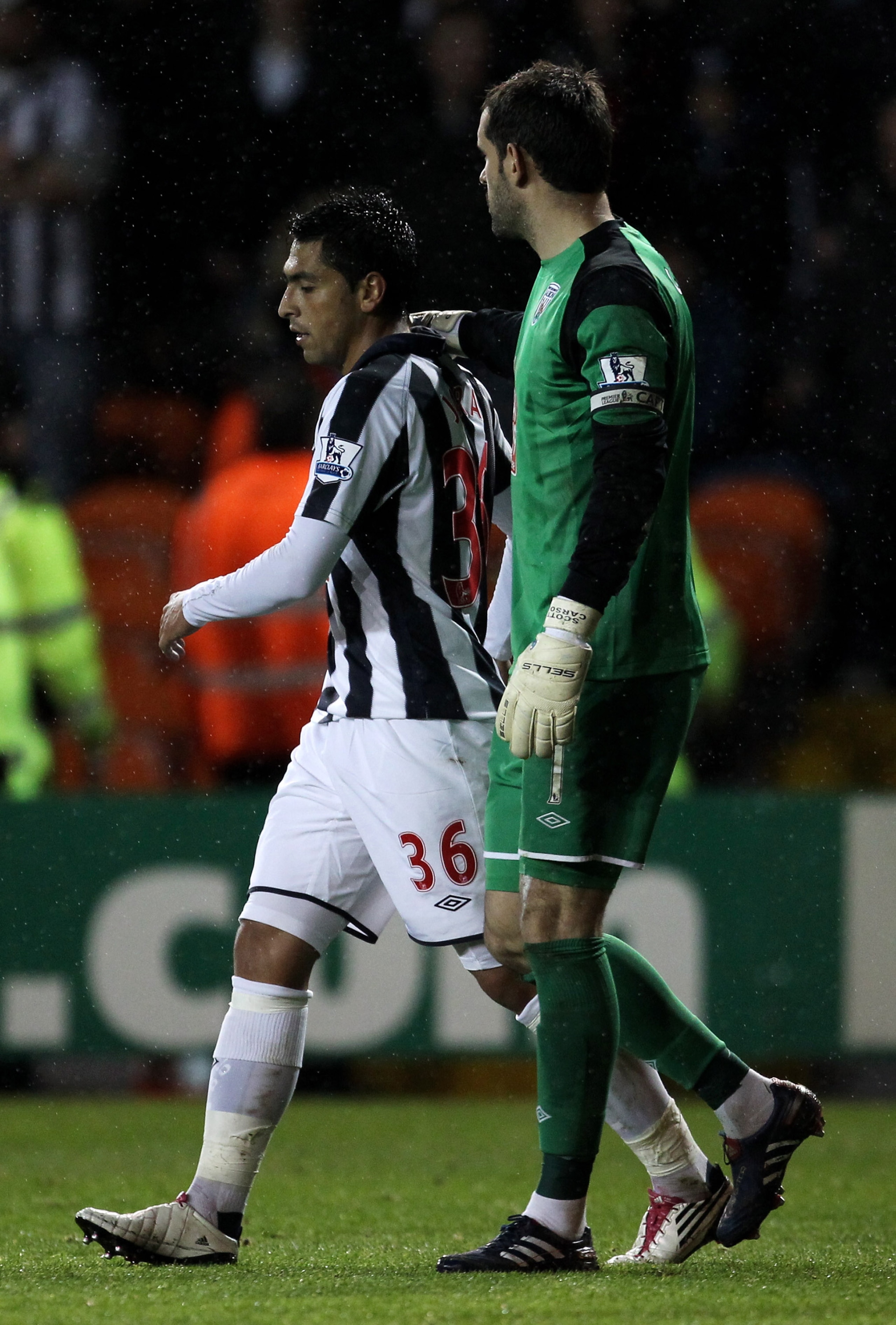 BLACKPOOL, ENGLAND - NOVEMBER 01: Gonzalo Jara of West Bromwich Albion is consoled by team mate Scott Carson (R) after being sent off during the Barclays Premier League match between Blackpool and West Bromwich Albion at Bloomfield Road on November 1, 20 BLACKPOOL, ENGLAND - NOVEMBER 01: Gonzalo Jara of West Bromwich Albion is consoled by team mate Scott Carson (R) after being sent off during the Barclays Premier League match between Blackpool and West Bromwich Albion at Bloomfield Road on November 1, 20