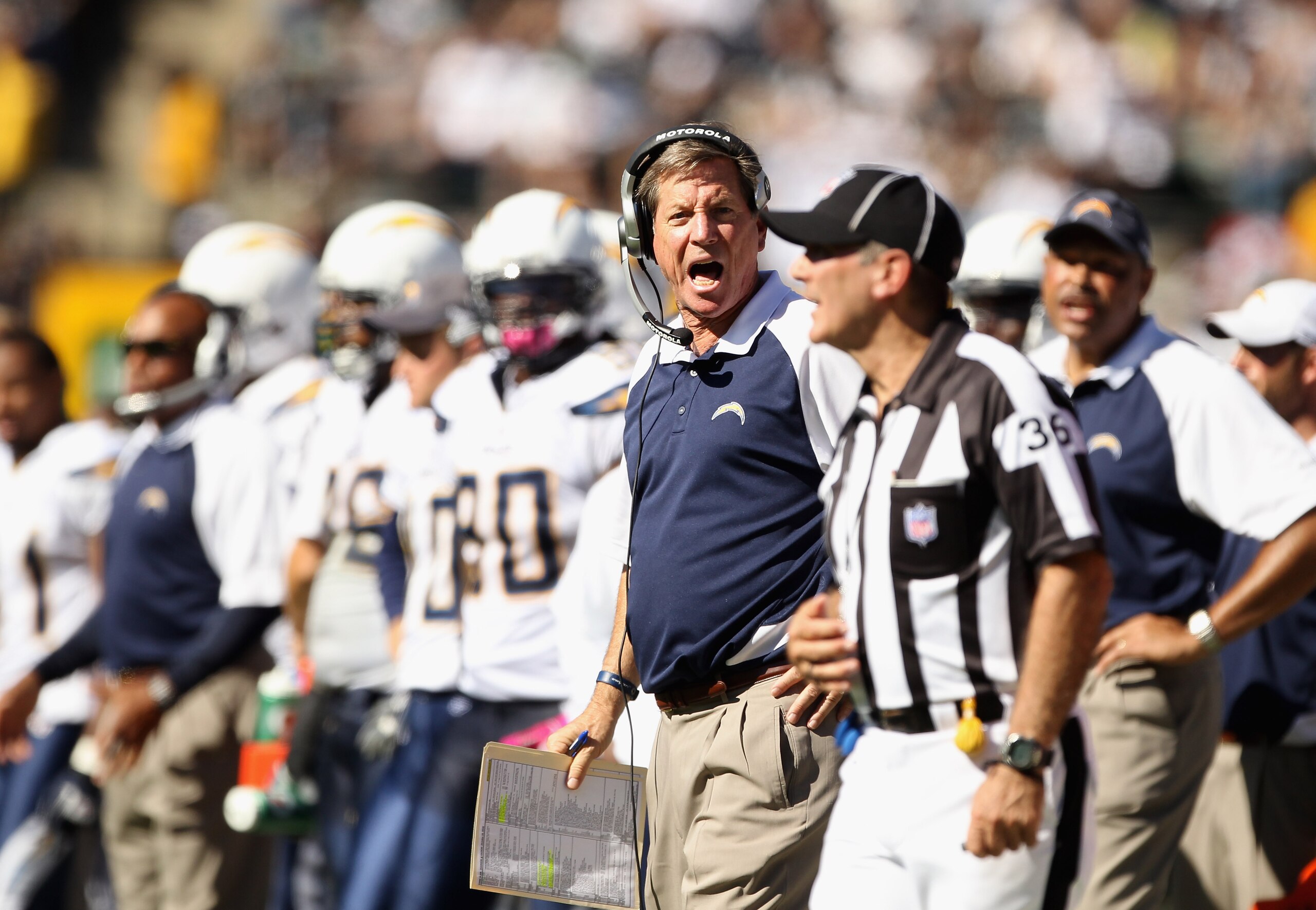 OAKLAND, CA - OCTOBER 10:  Head coach Norv Turner of the San Diego Chargers shouts at the linesman Tony Veteri during their game against the Oakland Raiders at Oakland-Alameda County Coliseum on October 10, 2010 in Oakland, California.  (Photo by Ezra Sha