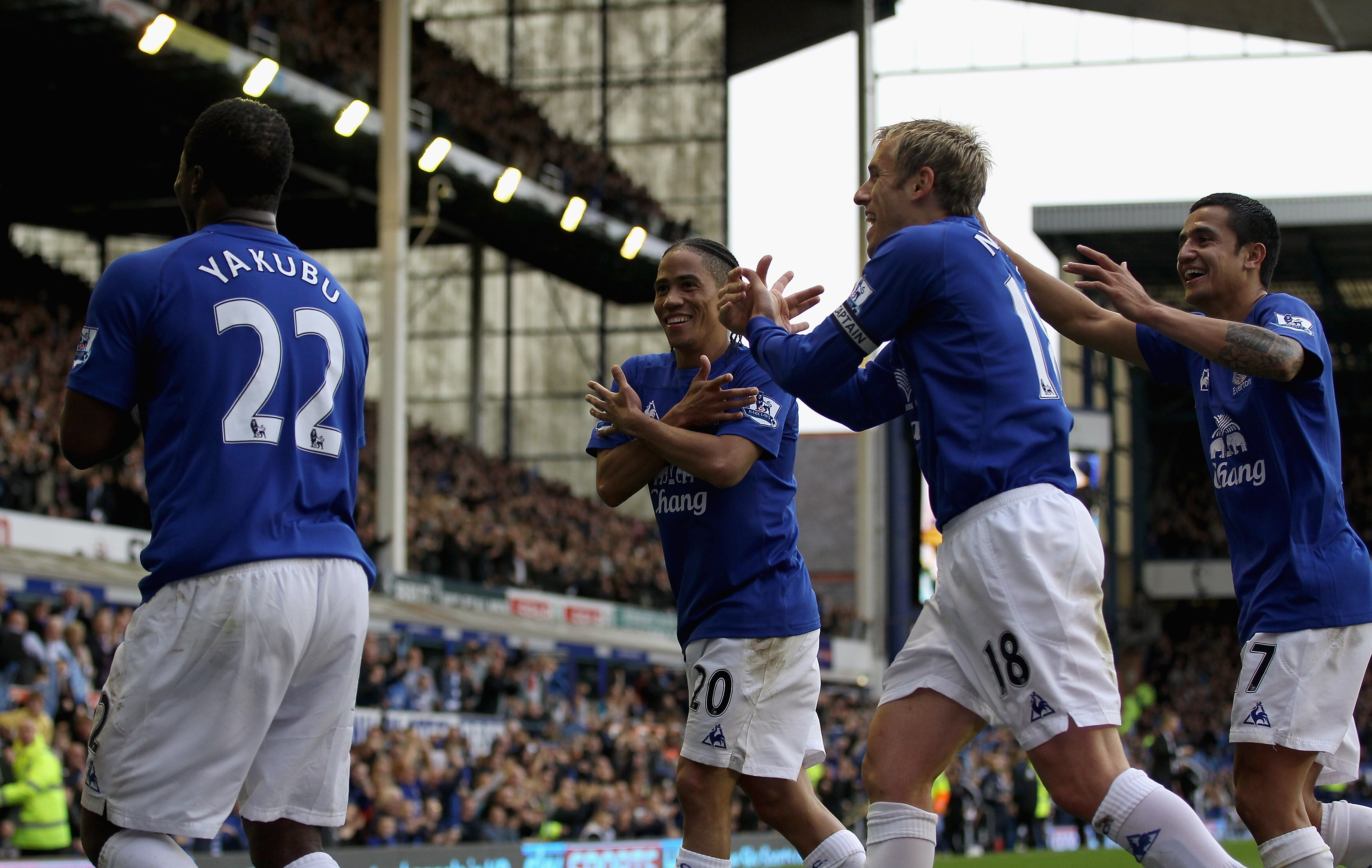 LIVERPOOL, ENGLAND - OCTOBER 30:  Yakubu of Everton celebrates after scoring his teams first and winning goal with his team mates Steven Pienaar,Phil Neville and Tim Cahill during the Barclays Premier League match between Everton and Stoke City at Goodiso