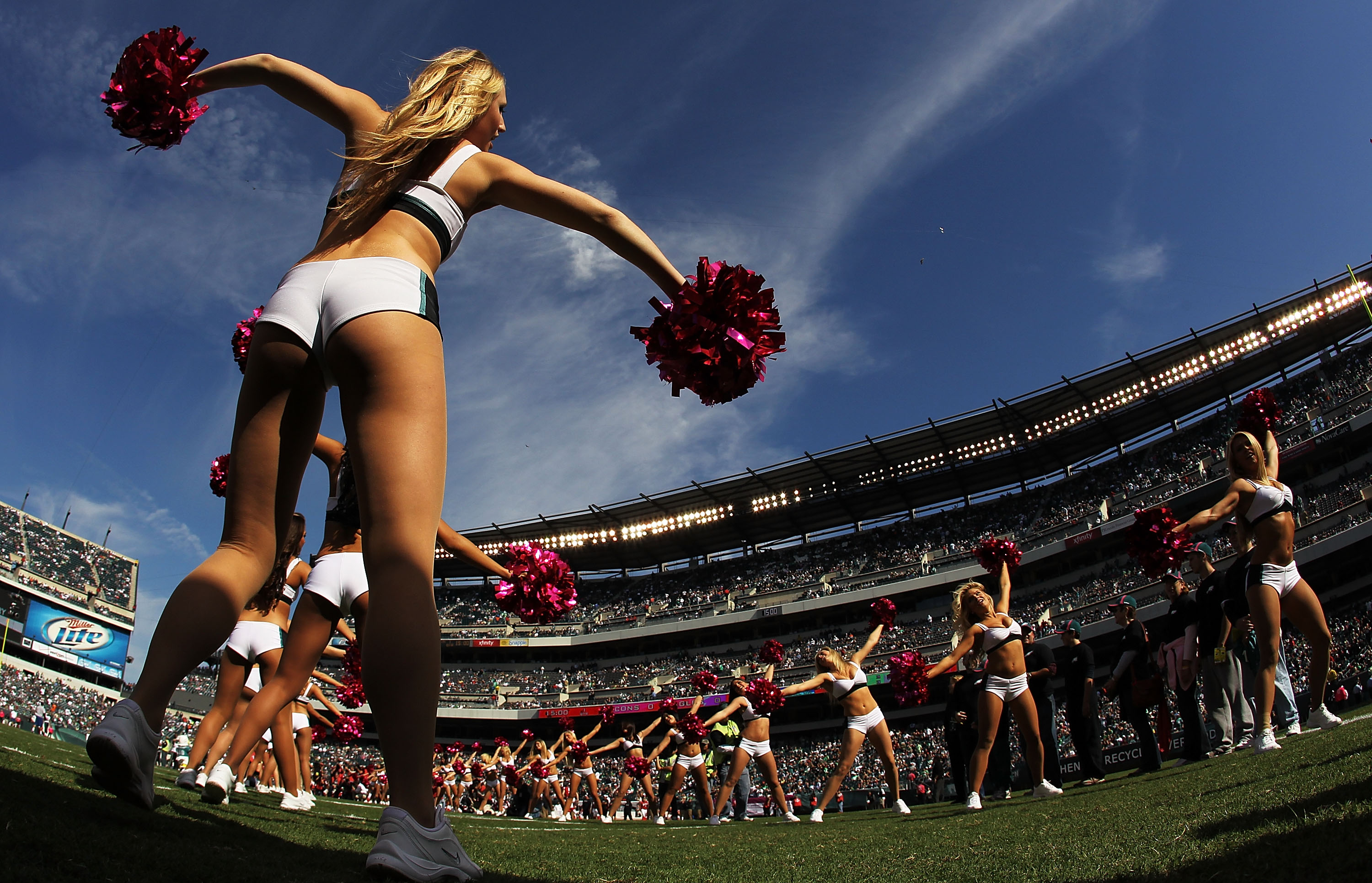 PHILADELPHIA - OCTOBER 17:  A Philadelphia Eagles cheerleader greets the Eagles as they take the field against the Atlanta Falcons during their game at Lincoln Financial Field on October 17, 2010 in Philadelphia, Pennsylvania.  (Photo by Al Bello/Getty Im