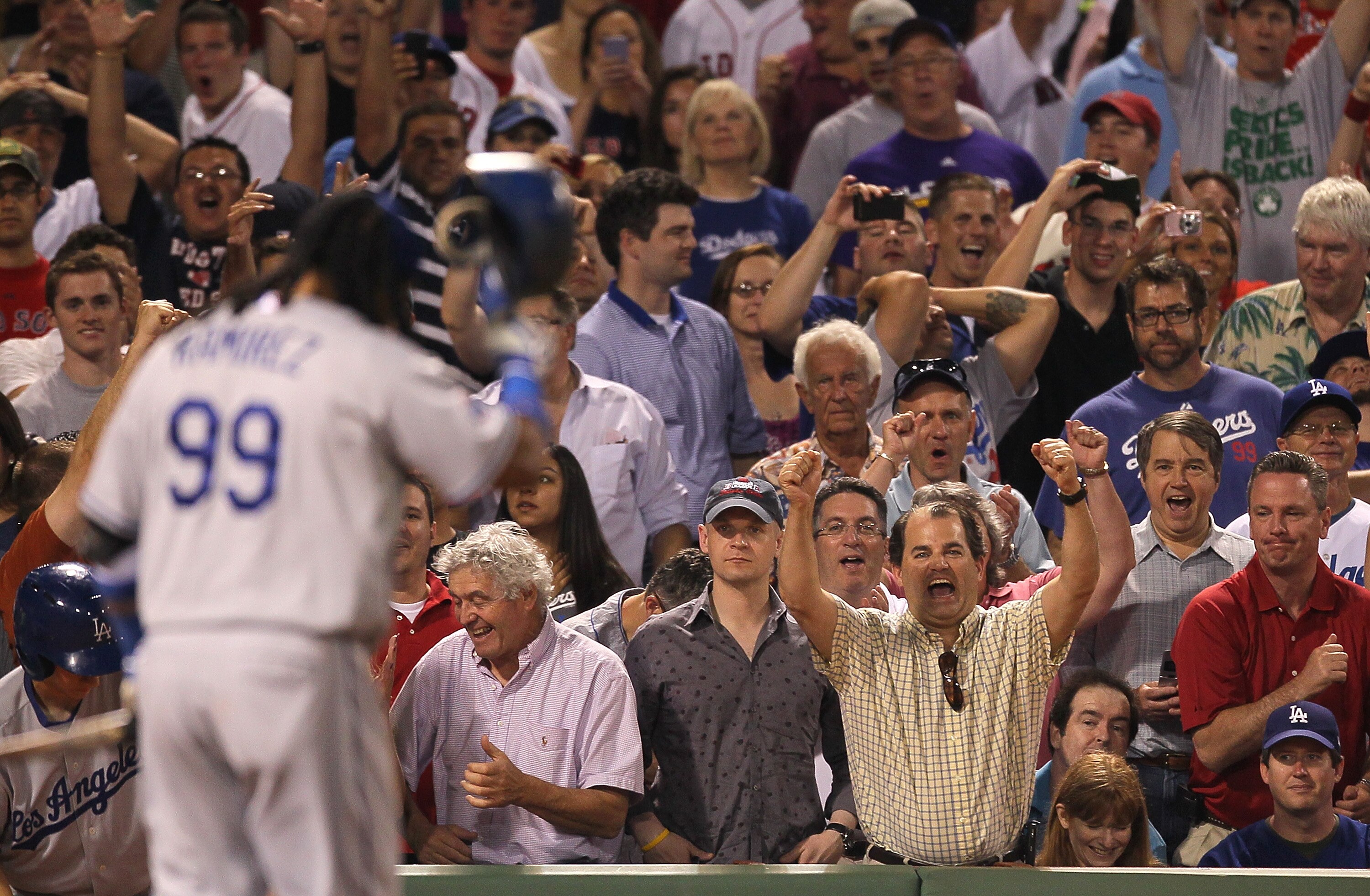 BOSTON - JUNE 18:  Red Sox fans cheer after Manny Ramirez #99 of the Los Angeles Dodgers struck out looking in the ninth inning with two men on base against the Boston Red Sox at Fenway Park on June 18, 2010 in Boston, Massachusetts. (Photo by Jim Rogash/