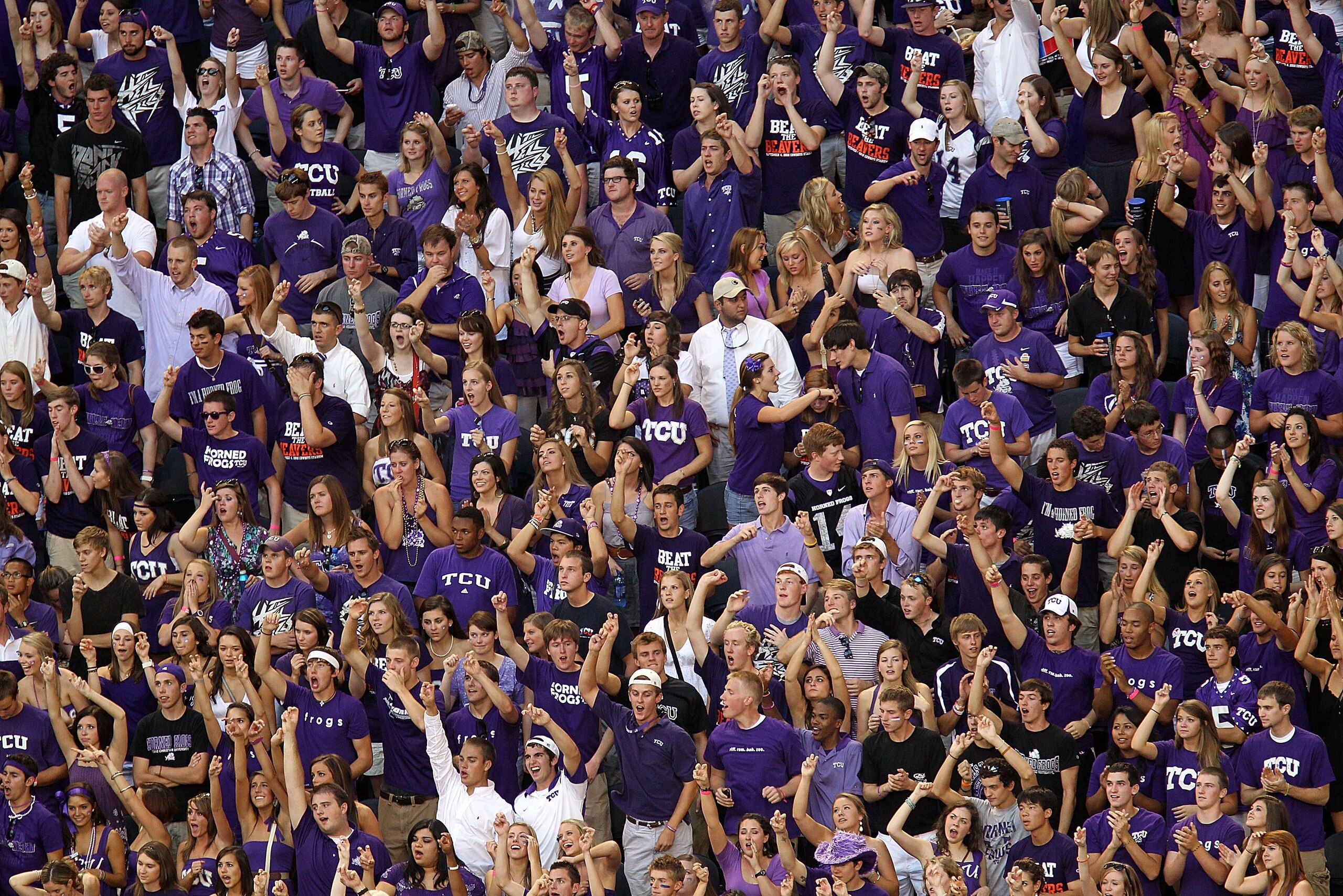 ARLINGTON, TX - SEPTEMBER 04:  Fans of the TCU Horned Frogs cheer during play against the Oregon State Beavers at Cowboys Stadium on September 4, 2010 in Arlington, Texas.  (Photo by Ronald Martinez/Getty Images)