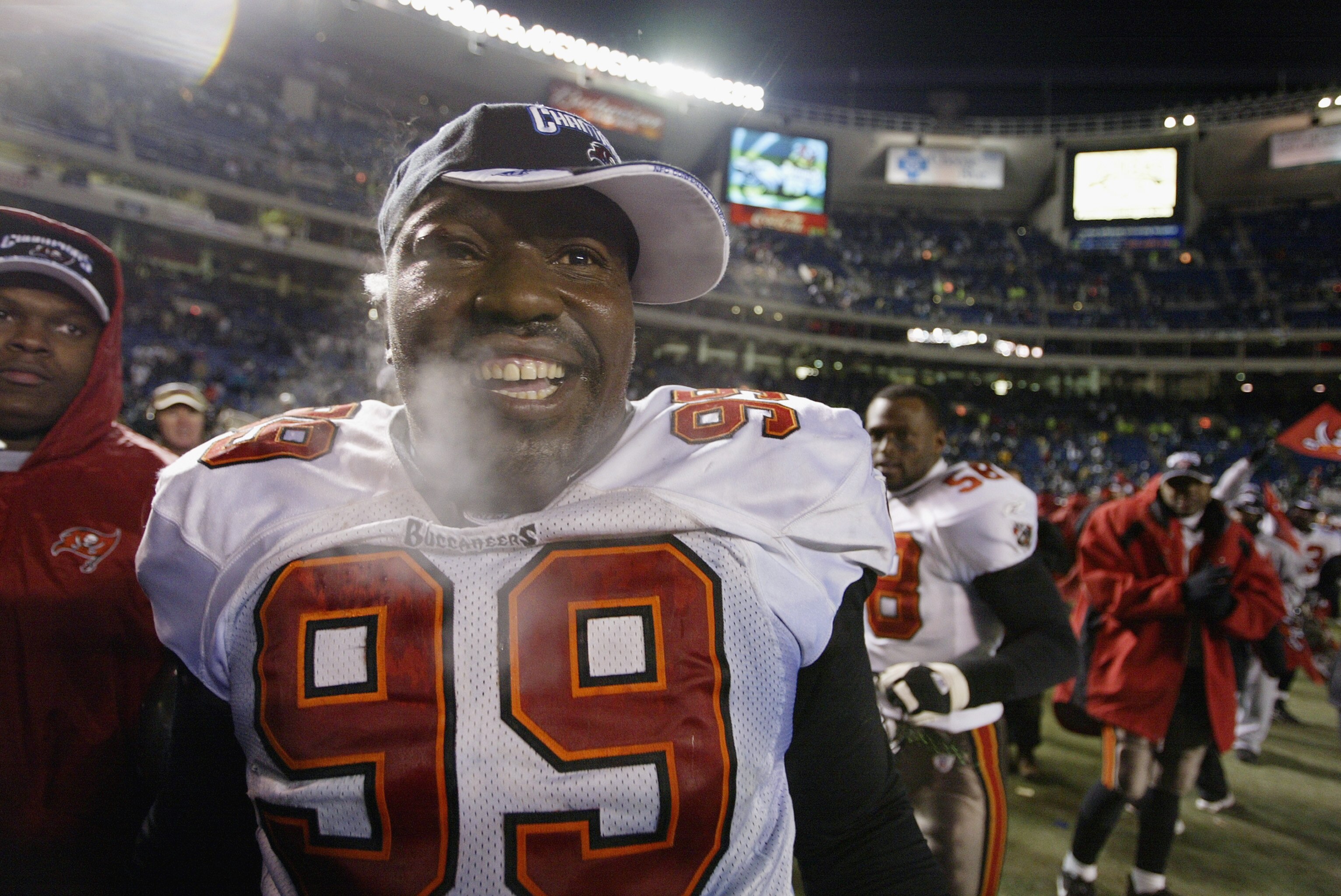 PHILADELPHIA - JANUARY 19:  Defensive tackle Warren Sapp #99 of the Tampa Bay Buccanneers celebrates following the NFC Championship game against the Philadelphia Eagles on January 19, 2003 at Veterans Stadium in Philadelphia, Pennsylvania. The Buccaneers