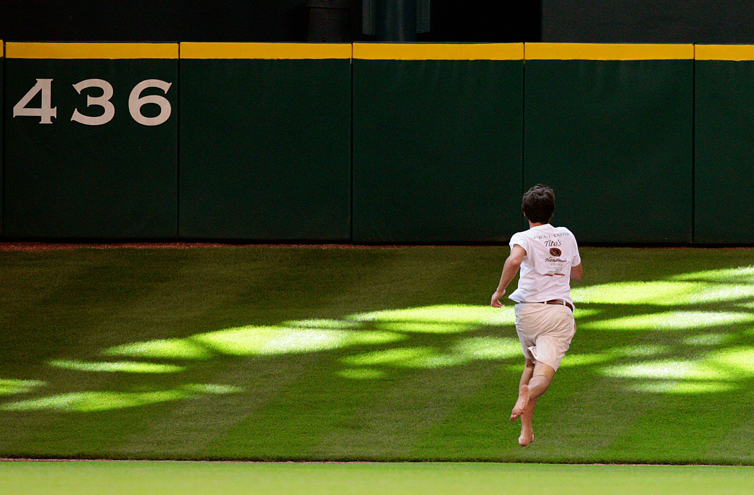 HOUSTON - MAY 31:  A fan runs on the field during the seventh inning during a baseball game between the Washington Nationals and Houston Astros at Minute Maid Park on May 31, 2010 in Houston, Texas.  (Photo by Bob Levey/Getty Images)