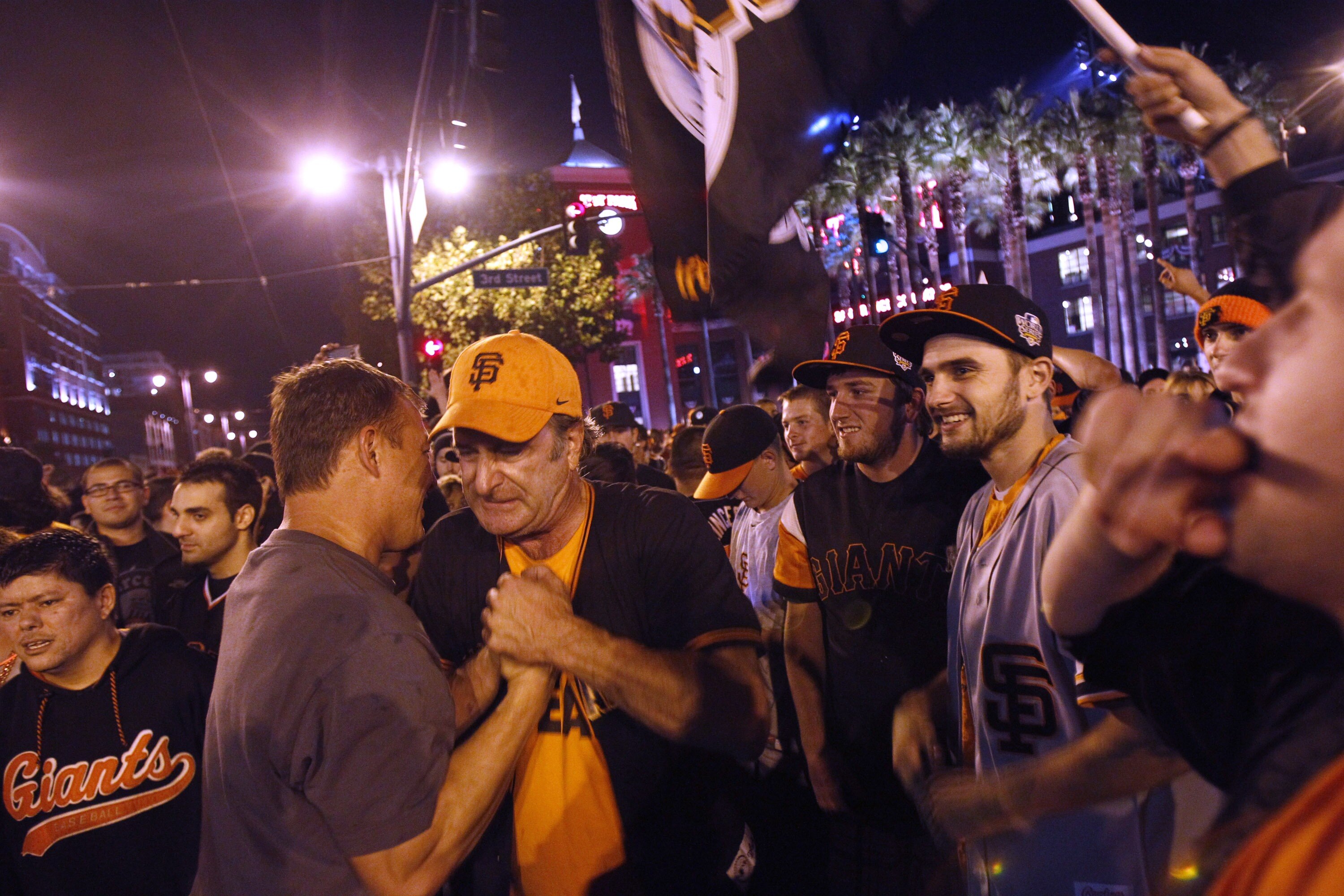 SAN FRANCISCO - NOVEMBER 1:  San Francisco baseball fans celebrate the Giants World Series Baseball win over the Texas Rangers outside AT&T Park on November 1, 2010 in San Francisco, California. The Giants defeated the Texas Rangers 3-1 in game 5 to win t