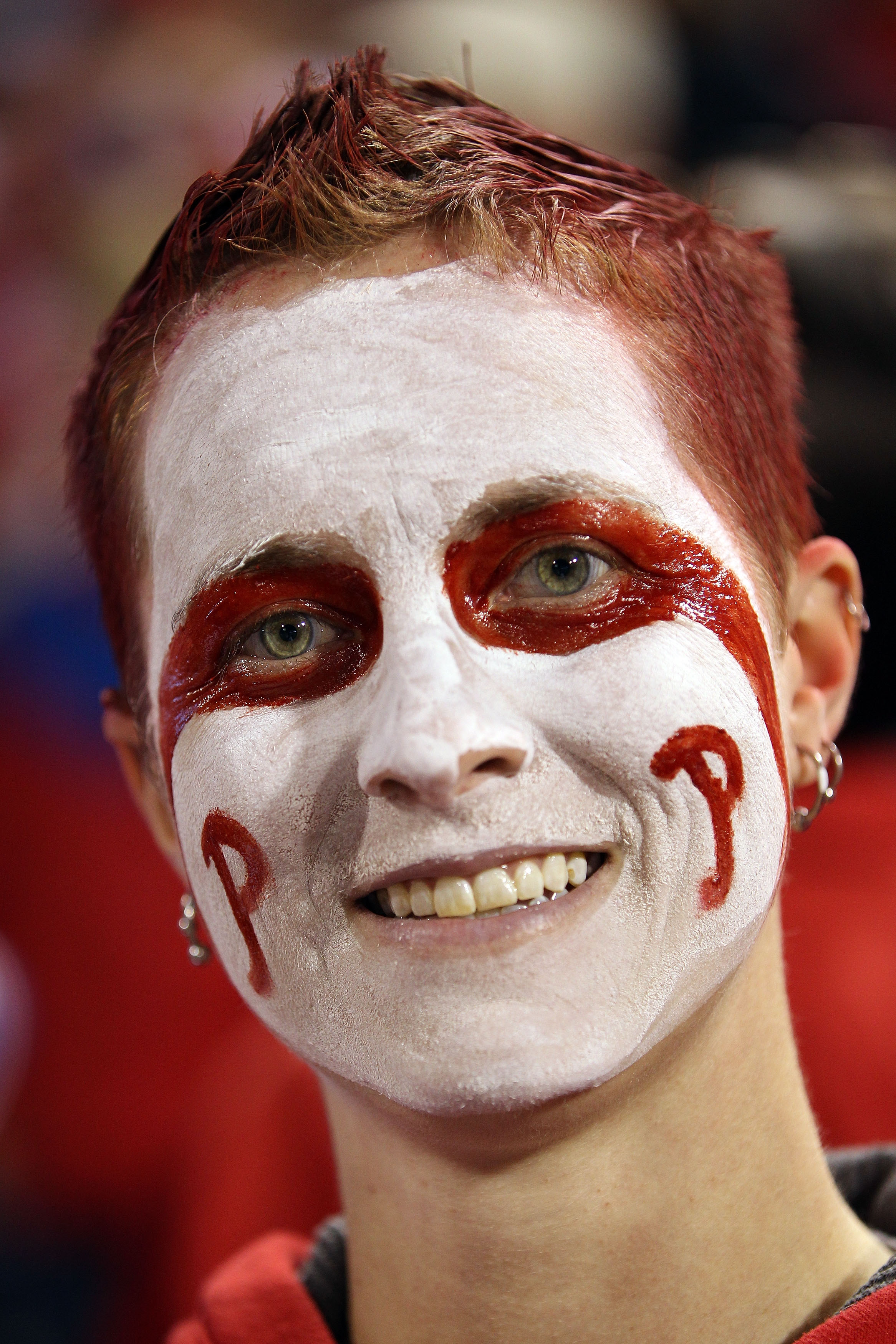 PHILADELPHIA - OCTOBER 23:  A fan of the Philadelphia Phillies with her face painted looks on during Game Six of the NLCS during the 2010 MLB Playoffs at Citizens Bank Park on October 23, 2010 in Philadelphia, Pennsylvania.  (Photo by Doug Pensinger/Getty