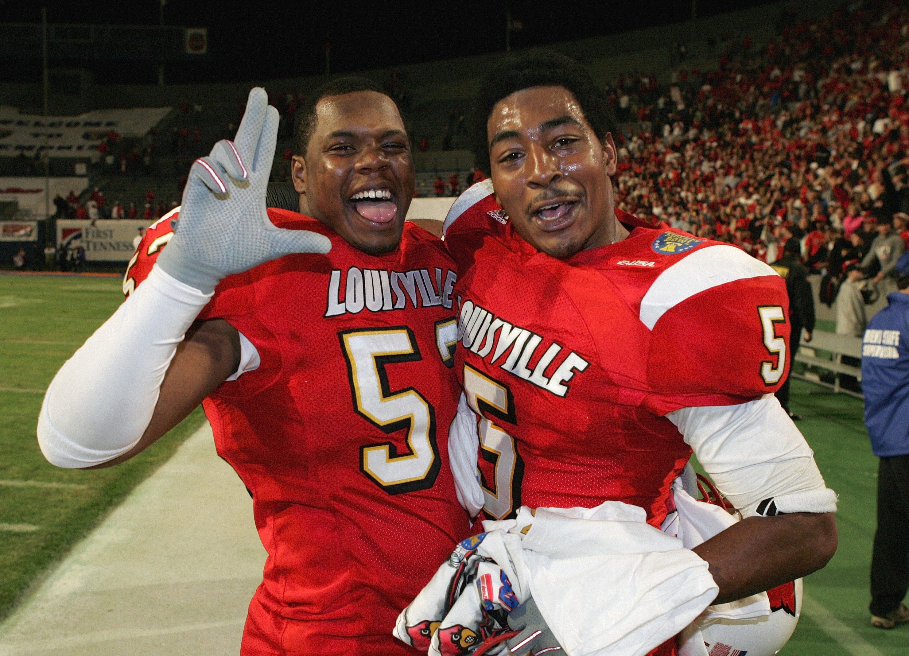 MEMPHIS, TN - DECEMBER 31: Linebacker Jonathan Jackerson #52 and cornerback Antoine Sharp #5 of the Louisville Cardinals celebrate after defeating the Boise State Broncos 44-40 in the AutoZone Liberty bowl at the Liberty Bowl on December 31, 2004 in Memph MEMPHIS, TN - DECEMBER 31: Linebacker Jonathan Jackerson #52 and cornerback Antoine Sharp #5 of the Louisville Cardinals celebrate after defeating the Boise State Broncos 44-40 in the AutoZone Liberty bowl at the Liberty Bowl on December 31, 2004 in Memph